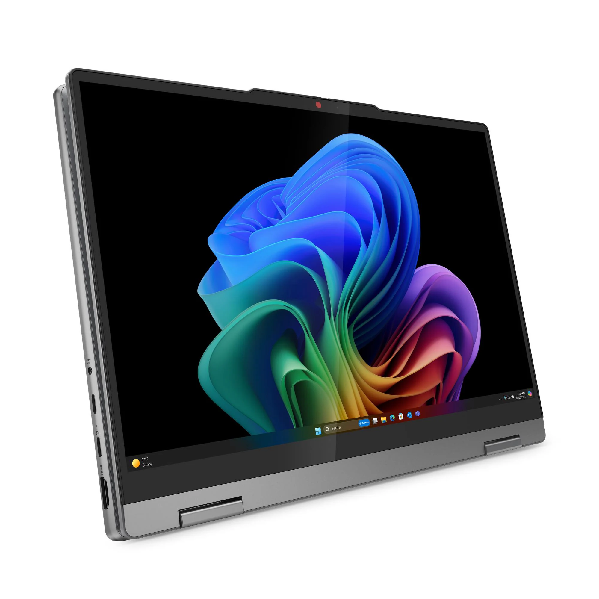 Ein silberner Laptop mit einem bunten Desktop-Hintergrund und einem roten Punkt über dem Bildschirm.