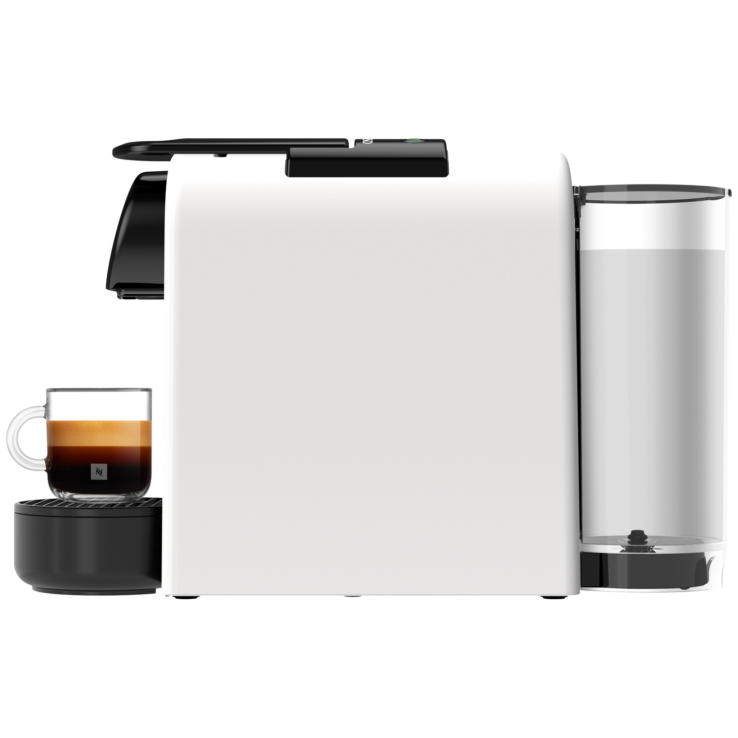 White coffee machine with a glass of espresso beside it and a milk container.