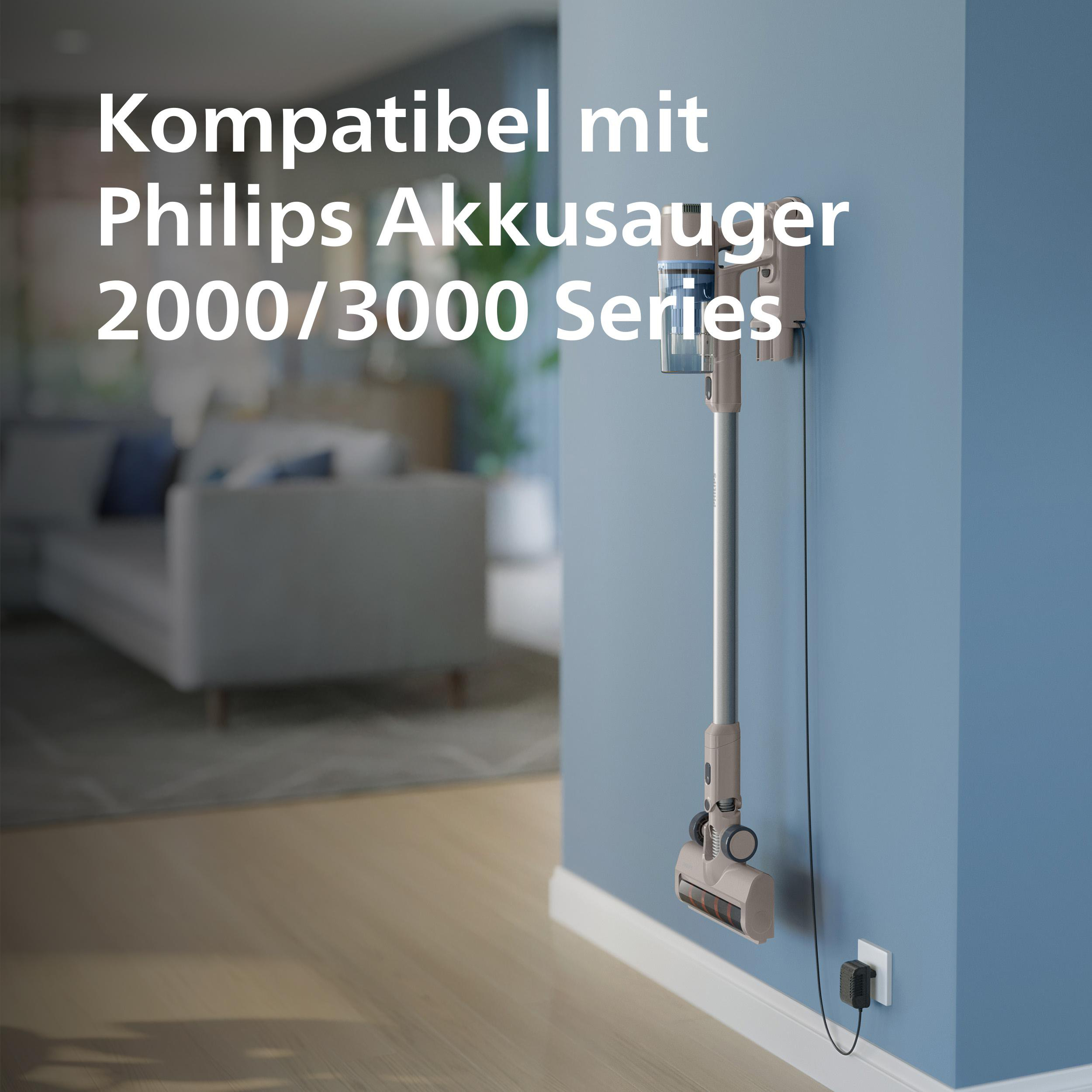 Ein Akkusauger ist an einer blauen Wand befestigt und lädt.
