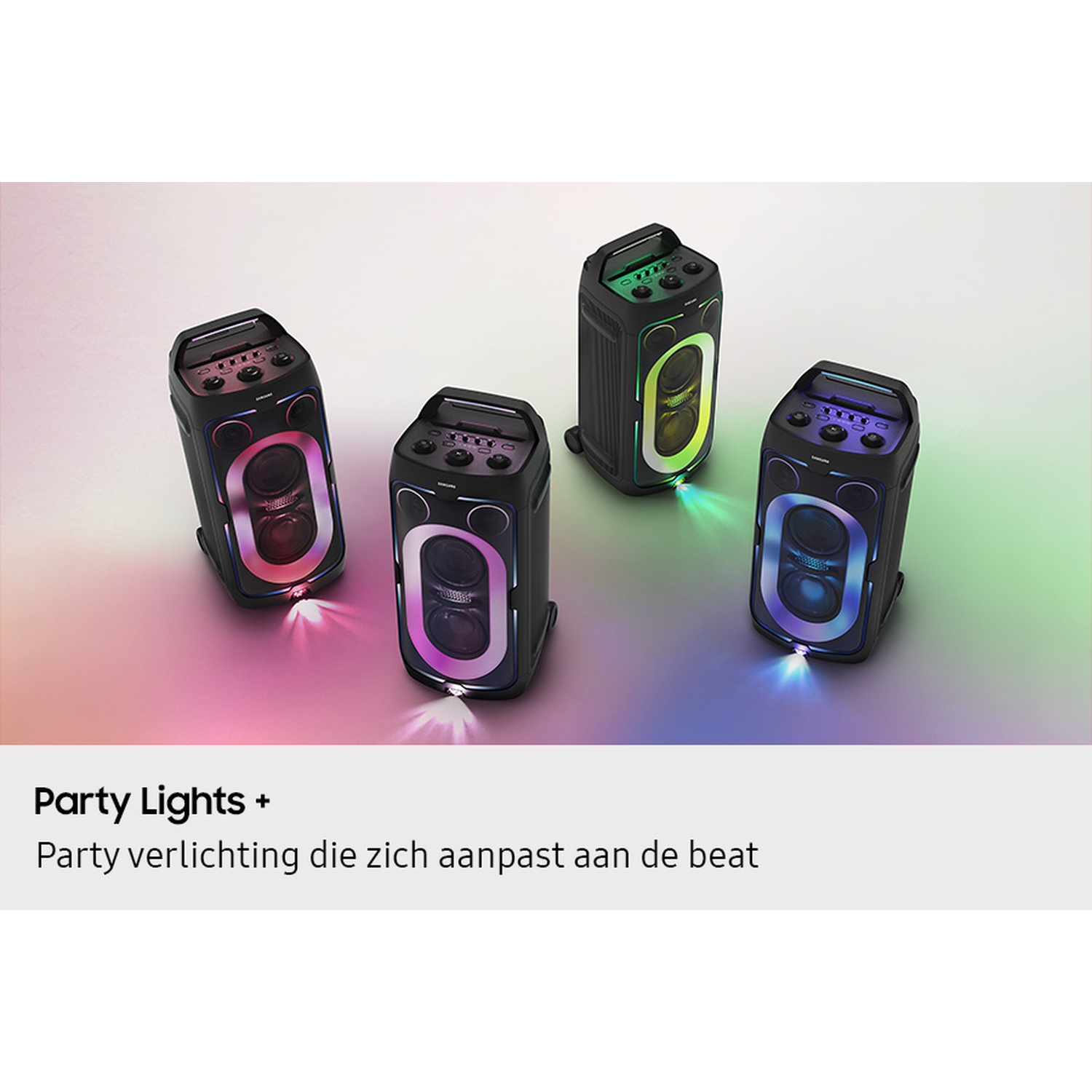 Four black party speakers with colorful lights on a pastel background.