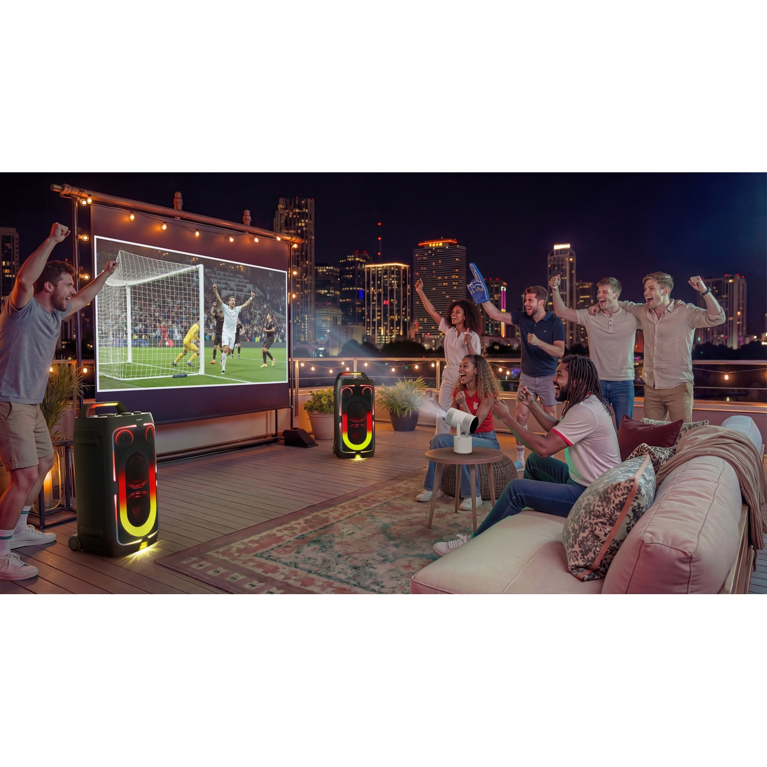 People cheer for soccer outdoors on a rooftop patio with city views.