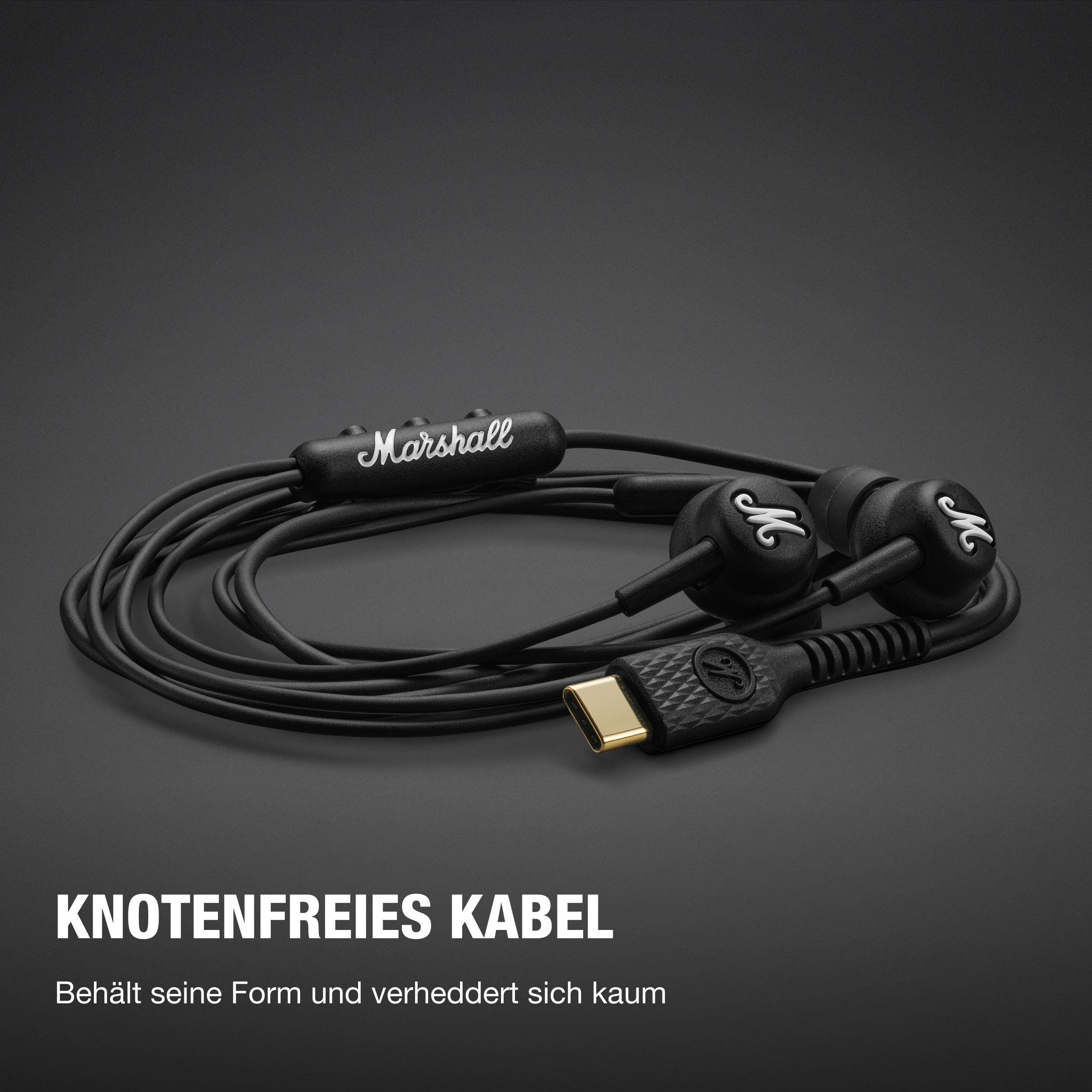 Schwarze Marshall-Kopfhörer mit USB-C-Anschluss und Kabel auf dunklem Hintergrund.