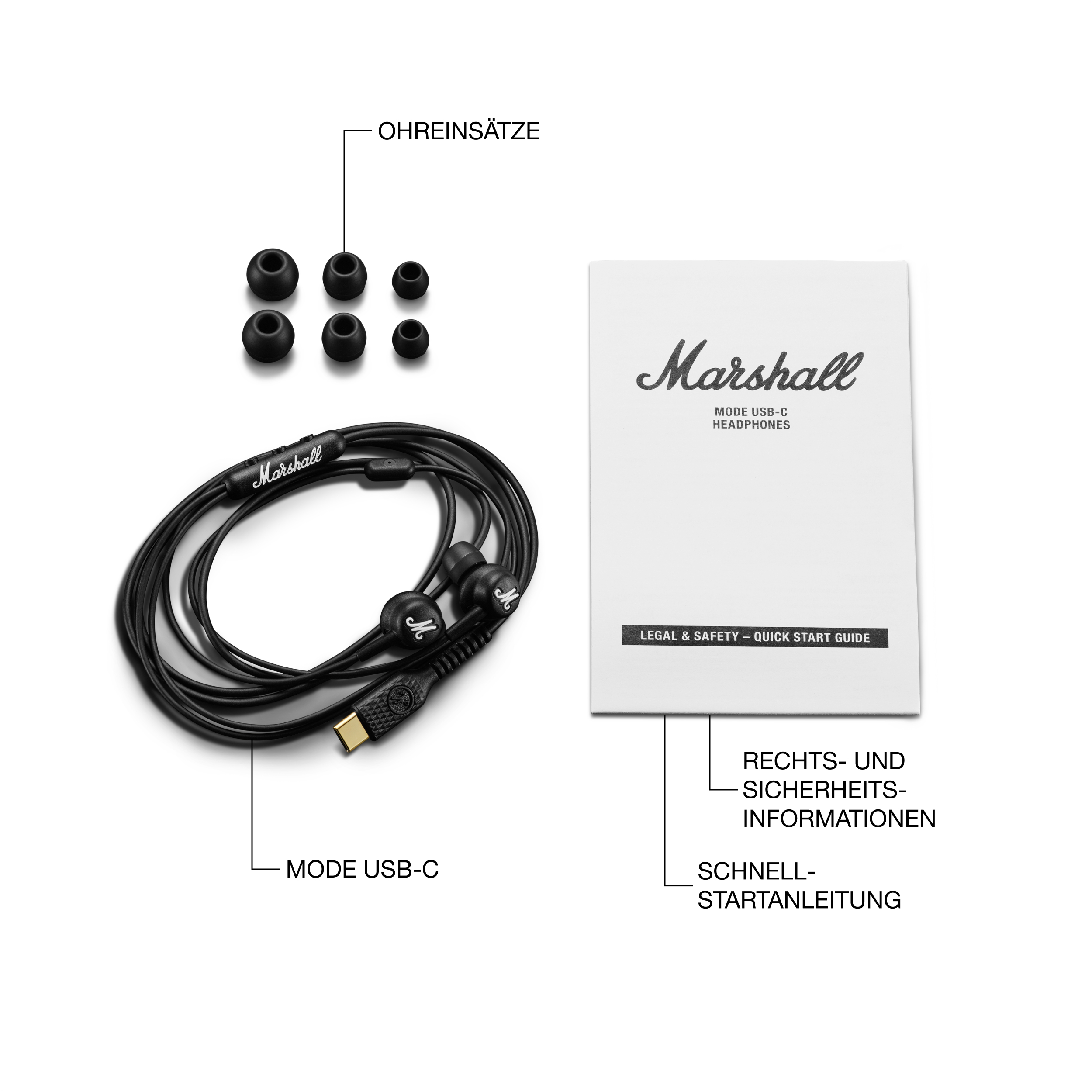 Schwarze Marshall In-Ear-Kopfhörer mit USB-C, Ersatz-Ohrstöpseln und Anleitung.