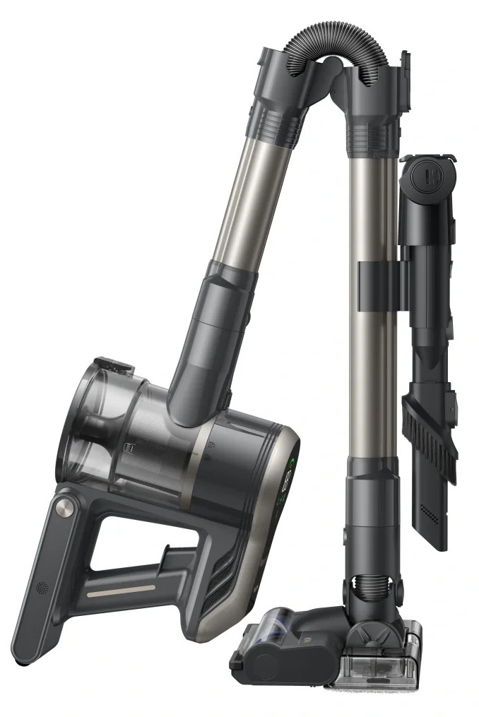 Odłączony szary i srebrny odkurzacz bezprzewodowy z akcesoriami, na białym tle.