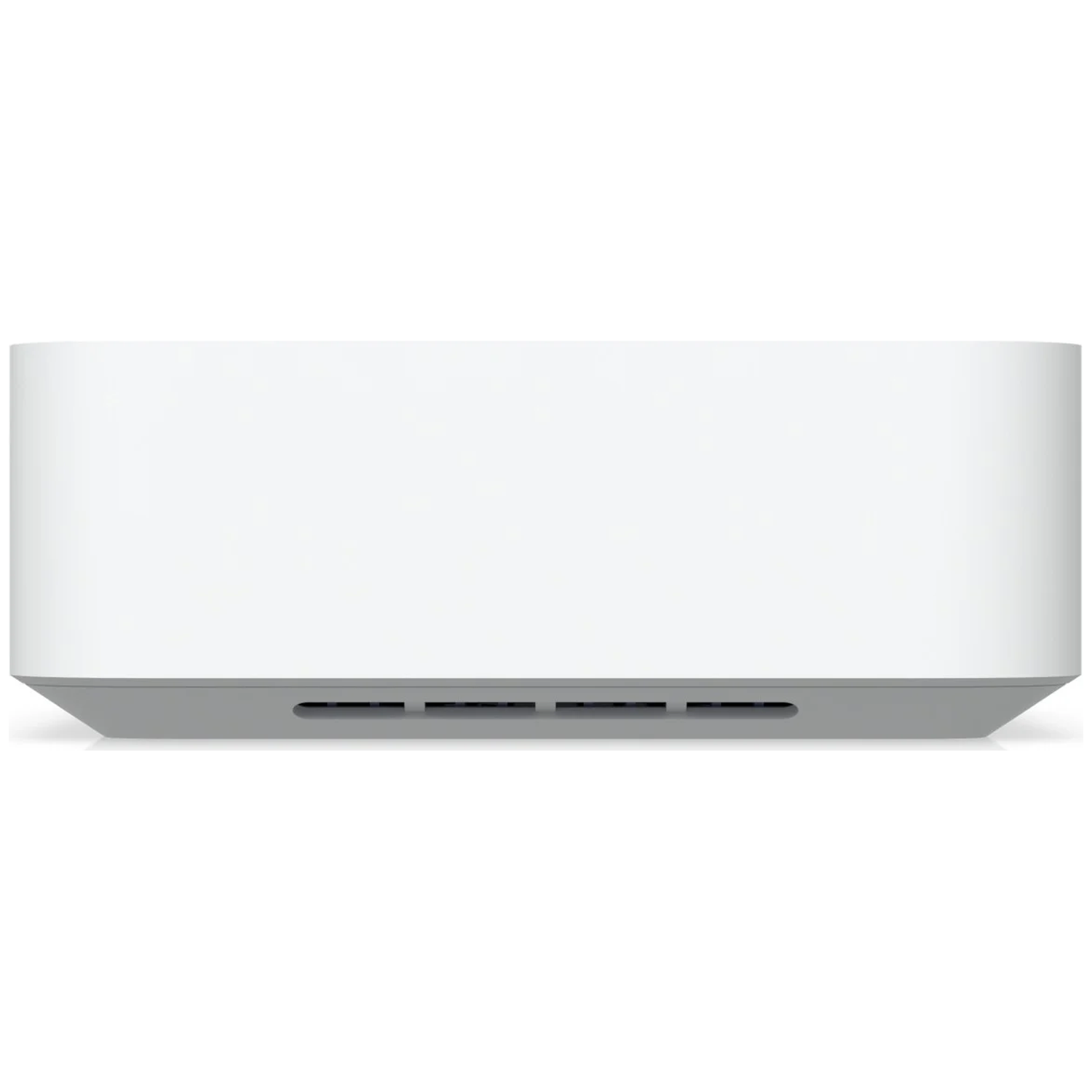 A white rectangular computer with a gray base and ventilation slots.