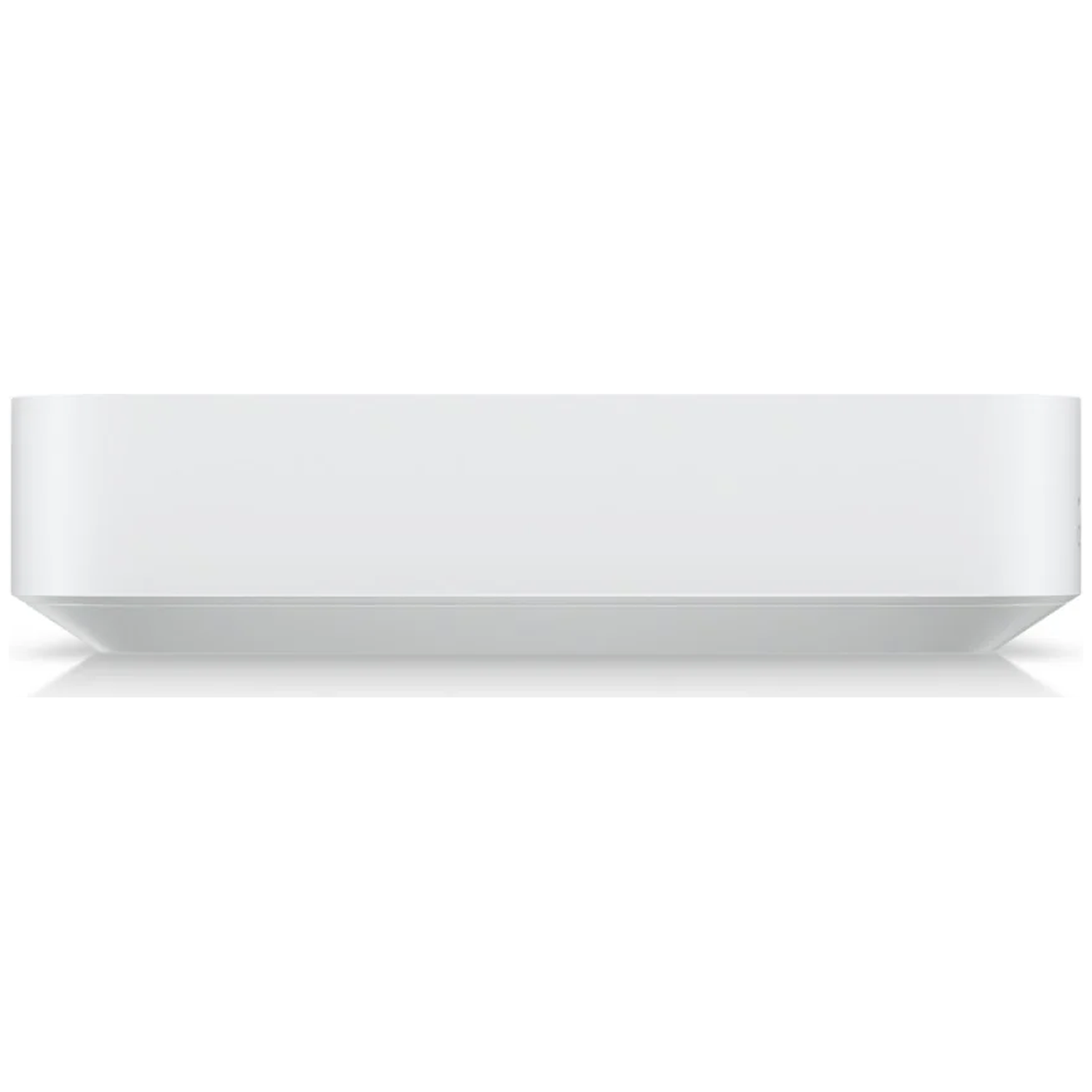 A white, rectangular device with rounded edges, resting on a reflective surface.