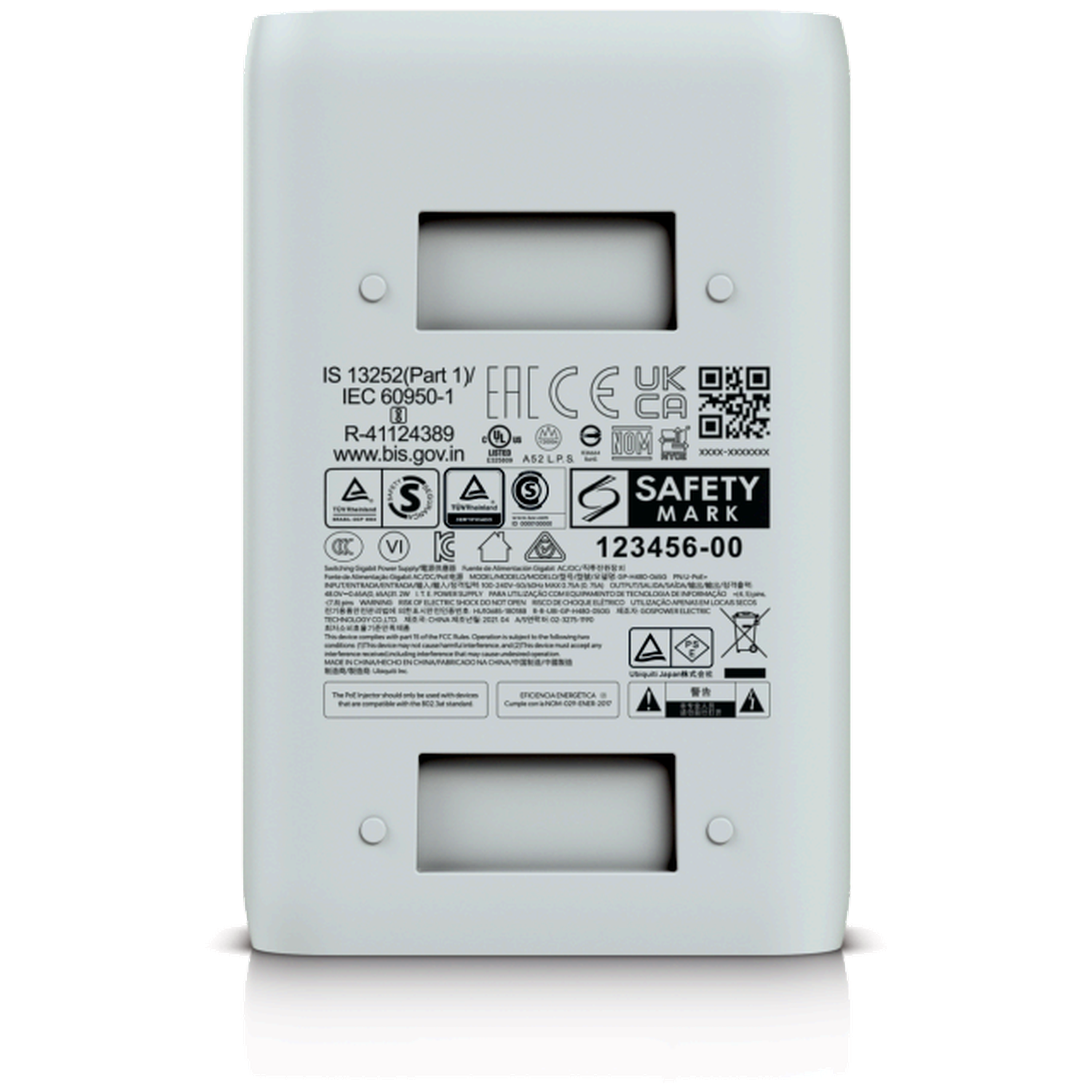 A white power adapter with various certification marks and QR codes.