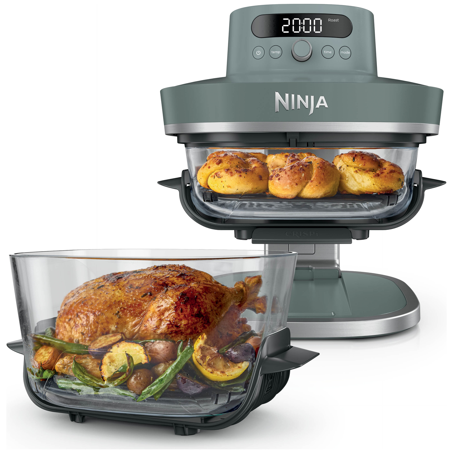 Gray Ninja air fryer oven with roasted chicken and vegetables in a glass pan.
