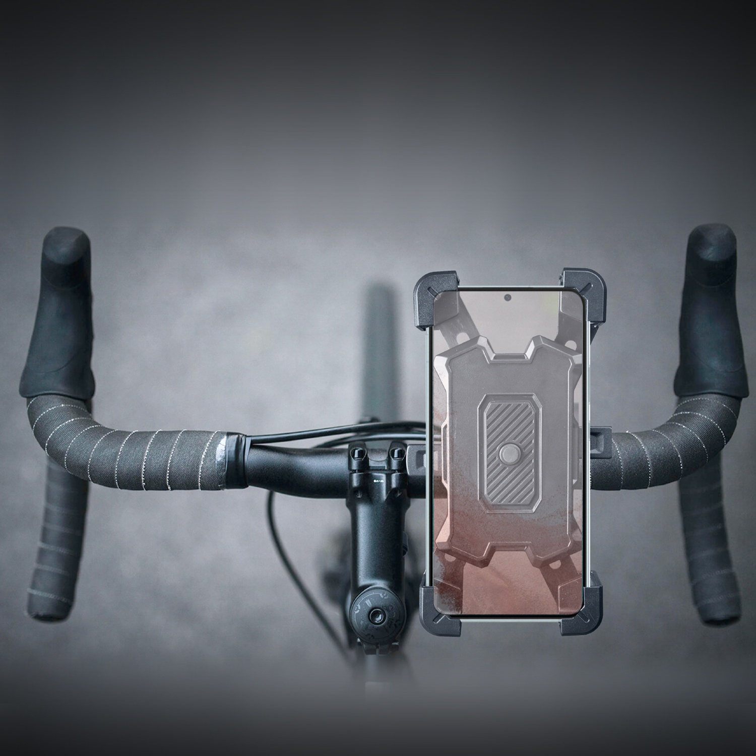 Bicycle handlebars with a mounted phone holder and smartphone.