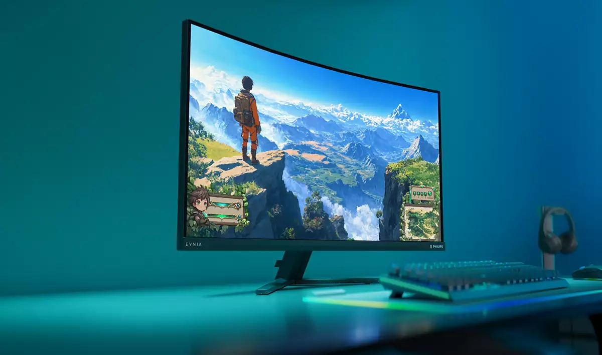 Ein gebogener Monitor zeigt eine Spielszene mit einer Figur auf einem Felsen.