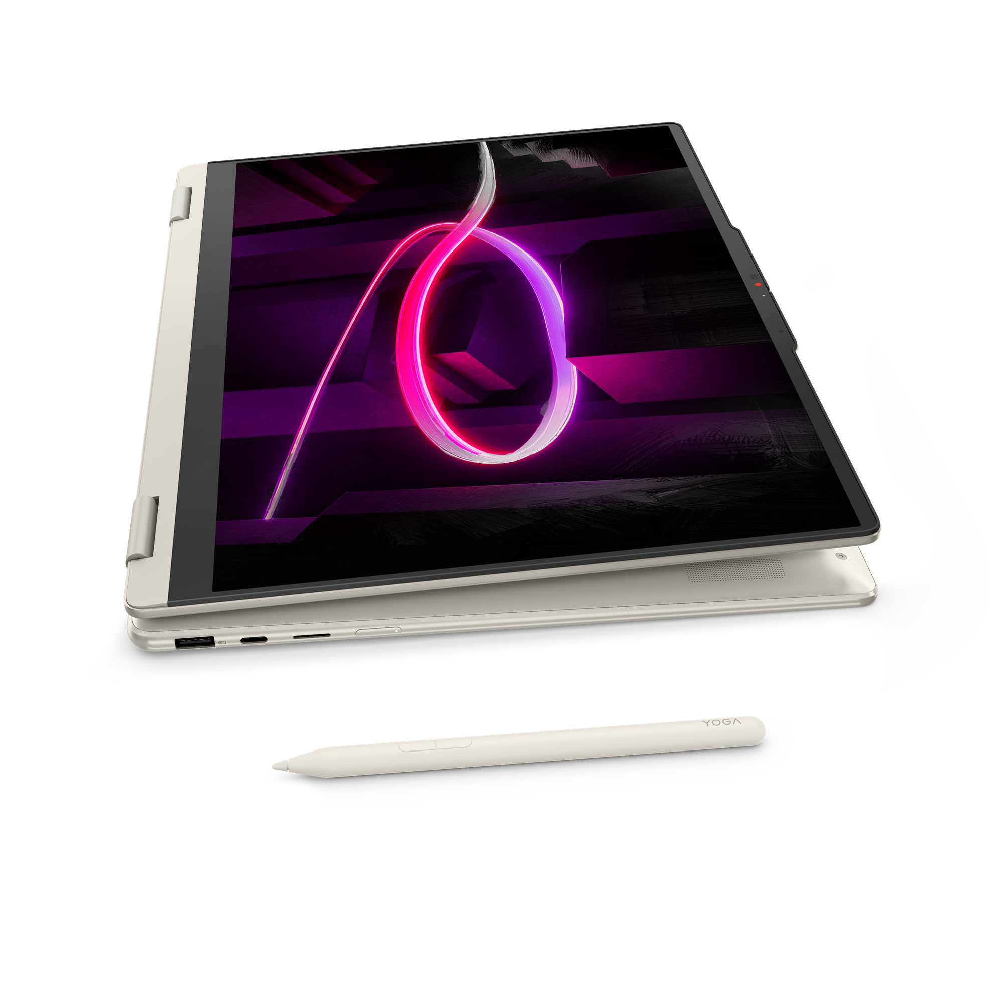 Ein geöffneter Laptop in Beige mit einem Stift davor, der auf schwarzem Hintergrund steht.