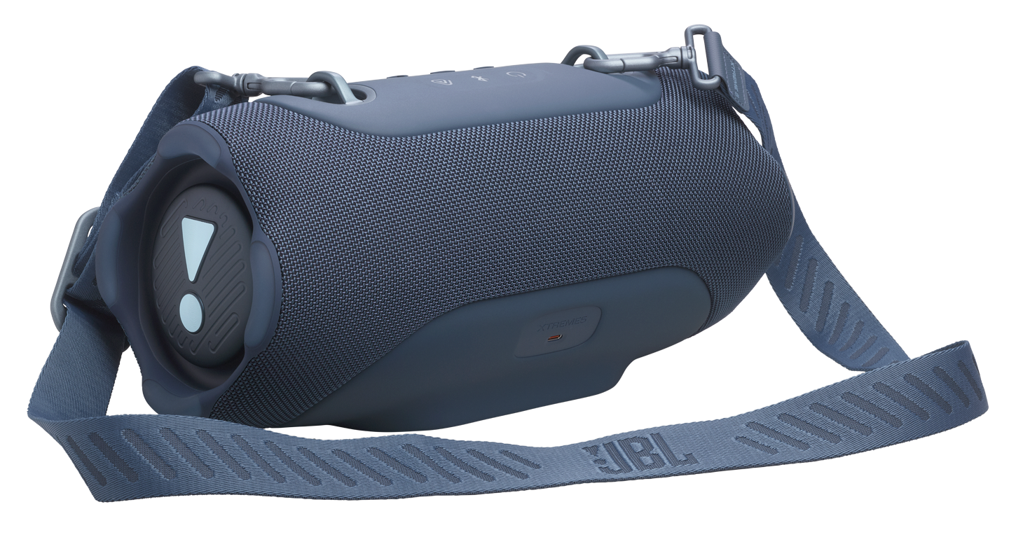 Niebieski głośnik JBL z paskiem, podświetlonym wykrzyknikiem i portem USB-C.