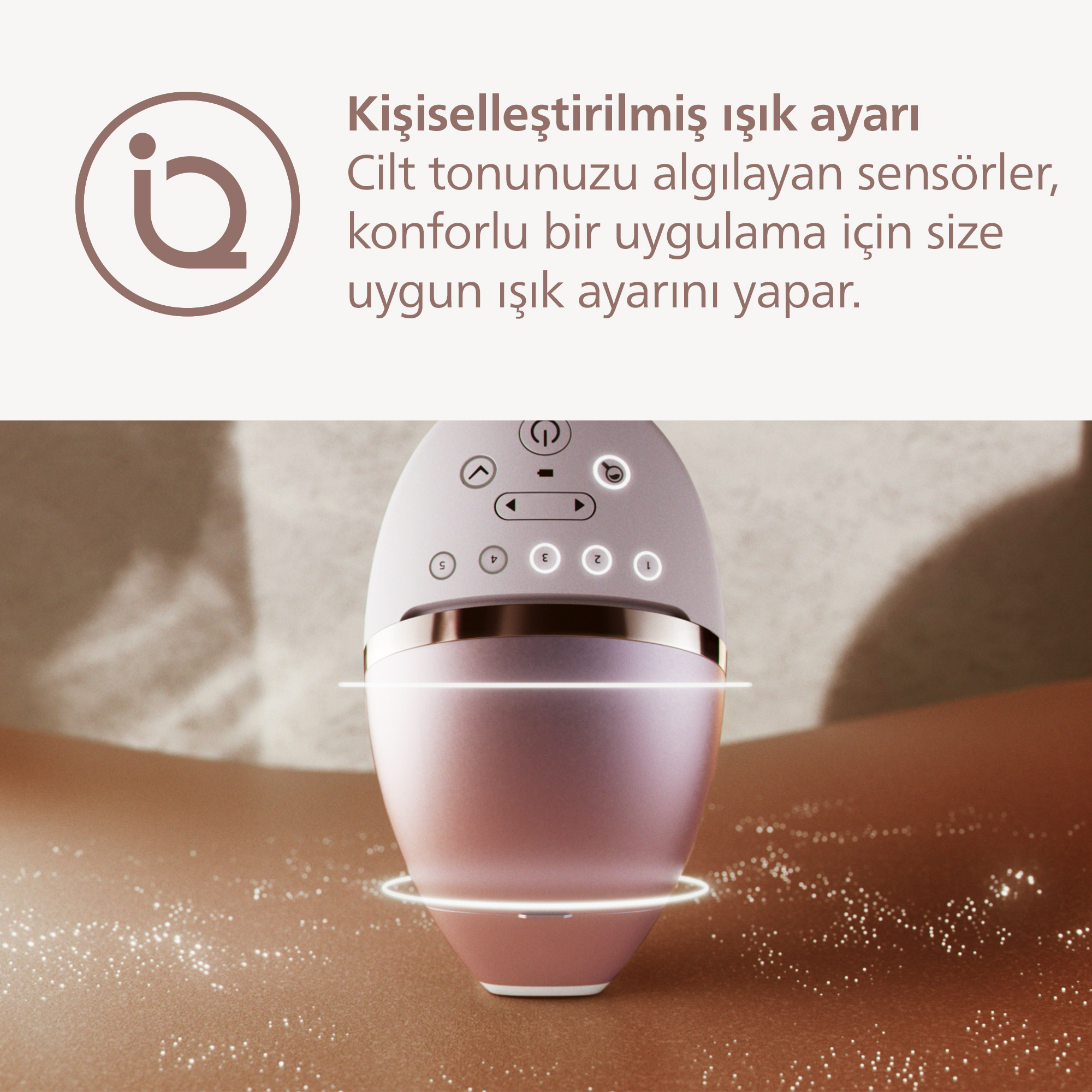 Cilt üzerinde dijital ayarlara sahip pembe epilatör.
