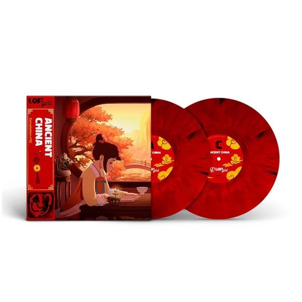 Eine Sammelbox mit zwei roten Vinylschallplatten und einem Cover mit einer Frau in traditioneller Kleidung.