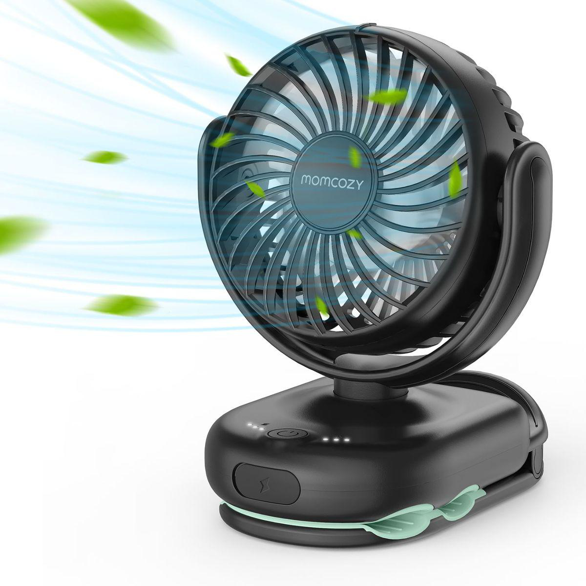 Ein schwarzer tragbarer Ventilator mit grünem Akzent, der Luft aufwirbelt.