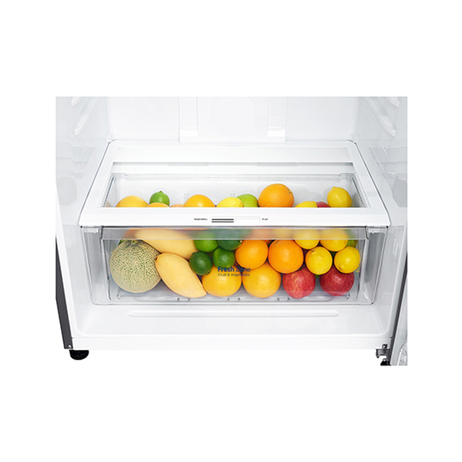 Cassettino frutta e verdura del frigorifero: mele, arance, lime, melone, mango.
