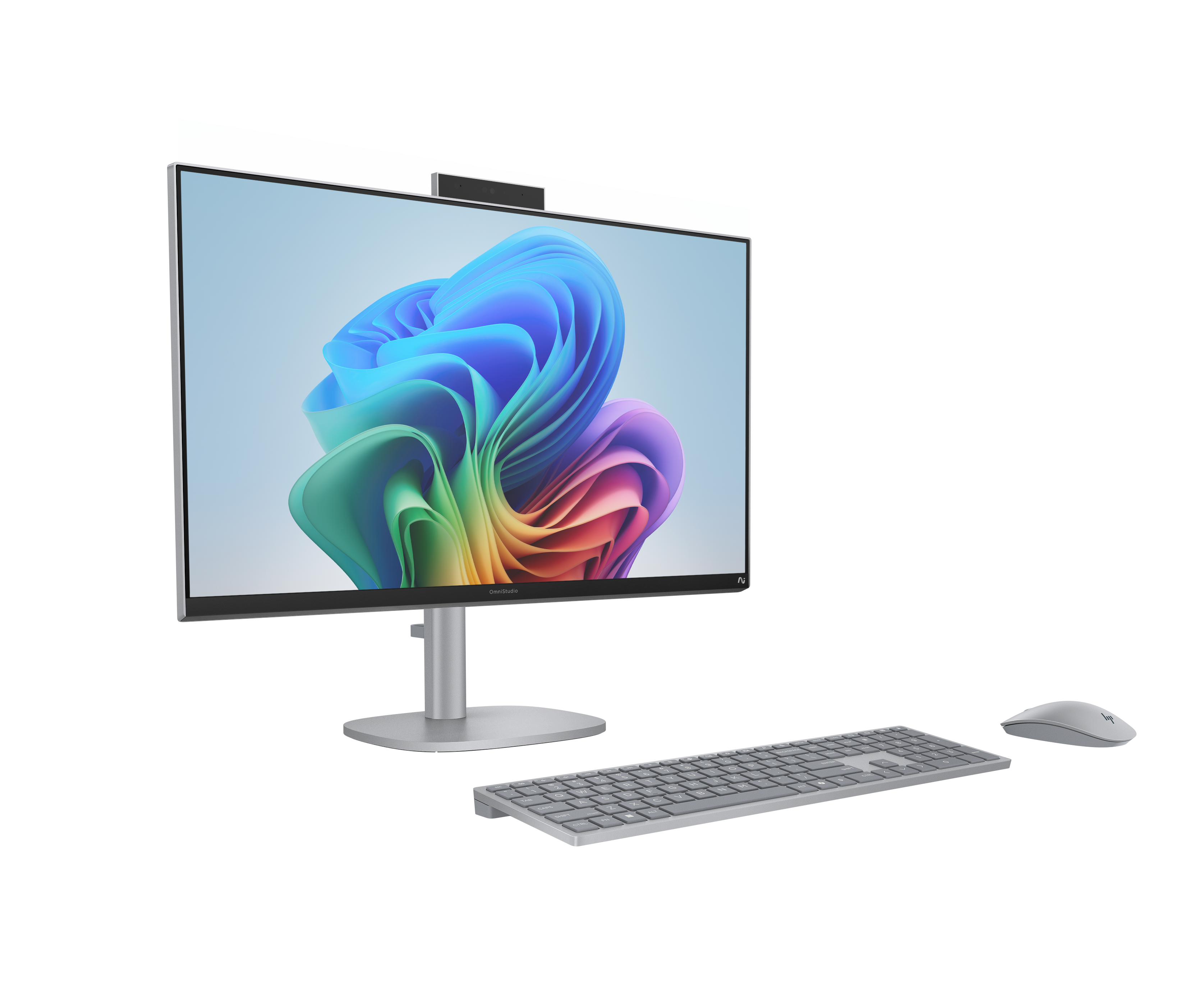 Een zilveren all-in-one computer met toetsenbord en muis op zwarte achtergrond.
