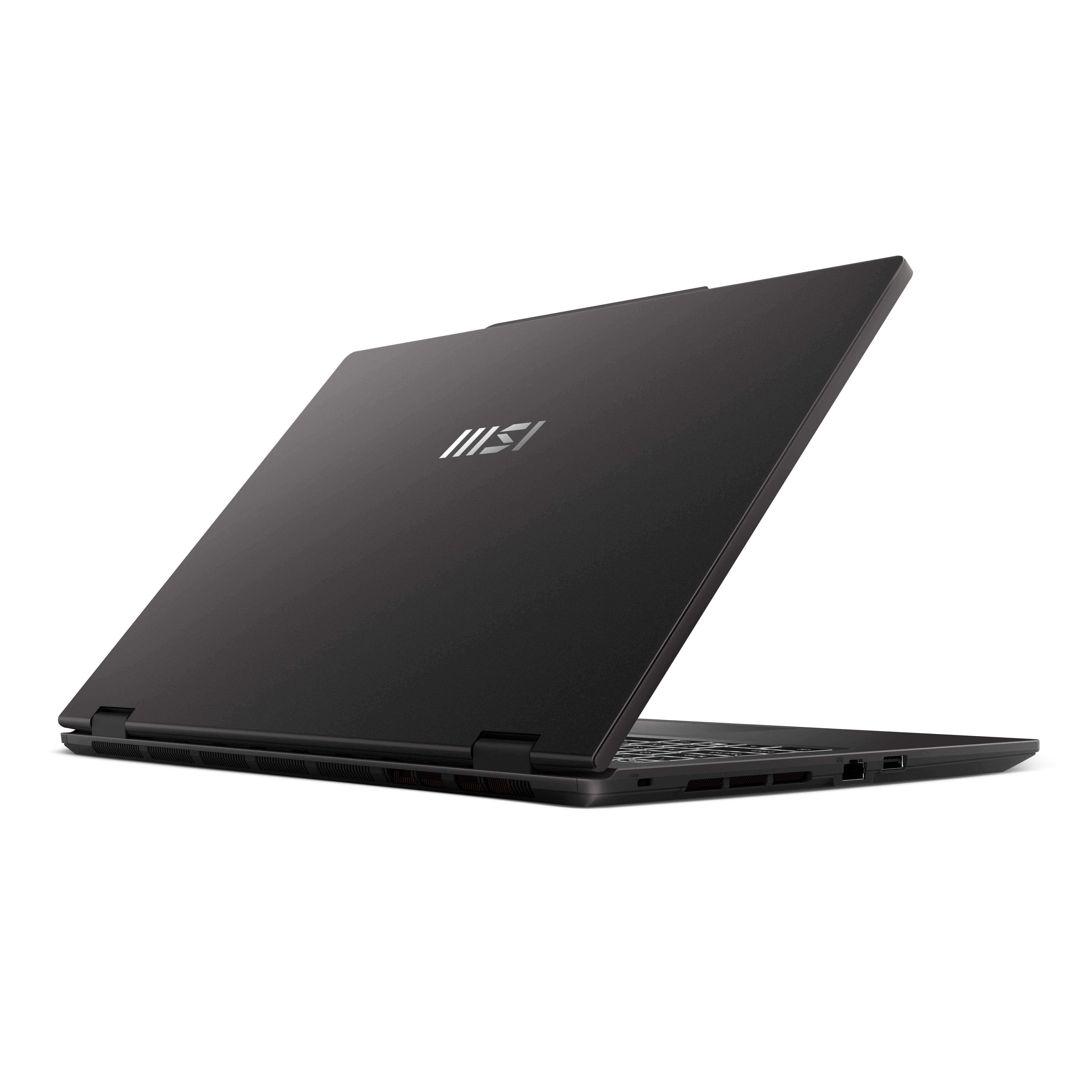Un ordinateur portable sombre avec le logo MSI sur le capot, sur fond noir.