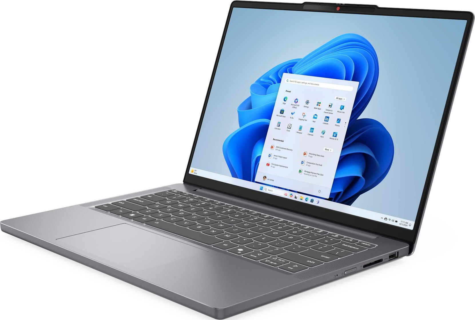 Laptop grigio con menu Start di Windows 11 aperto e sfondo blu.