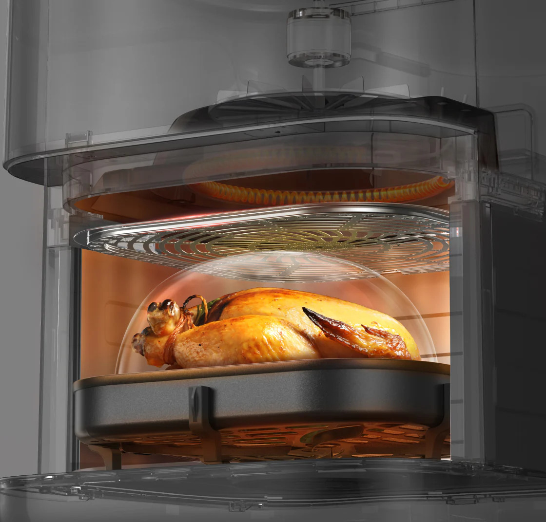 Złotobrązony pieczony ptak w przezroczystej obudowie, wystawiony na działanie ciepła.