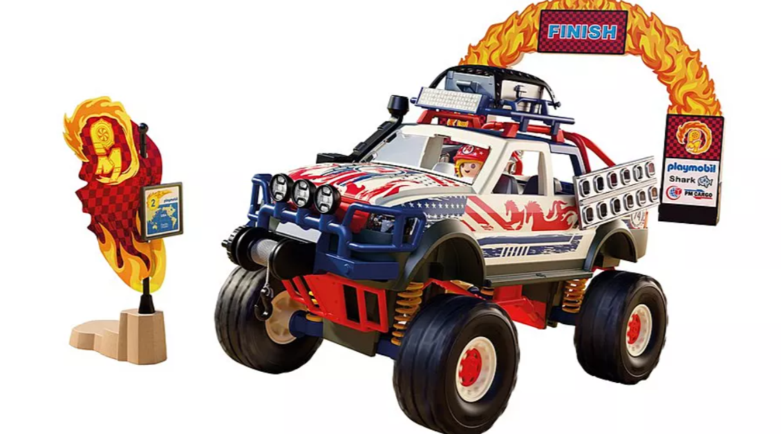 Ein Spielzeug-Monster-Truck mit Flammen-Finish-Tor und Flagge.