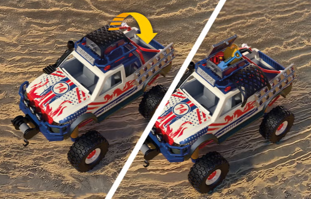 Ein Spielzeug-Pick-up mit amerikanischer Flaggen-Lackierung auf sandigem Untergrund.