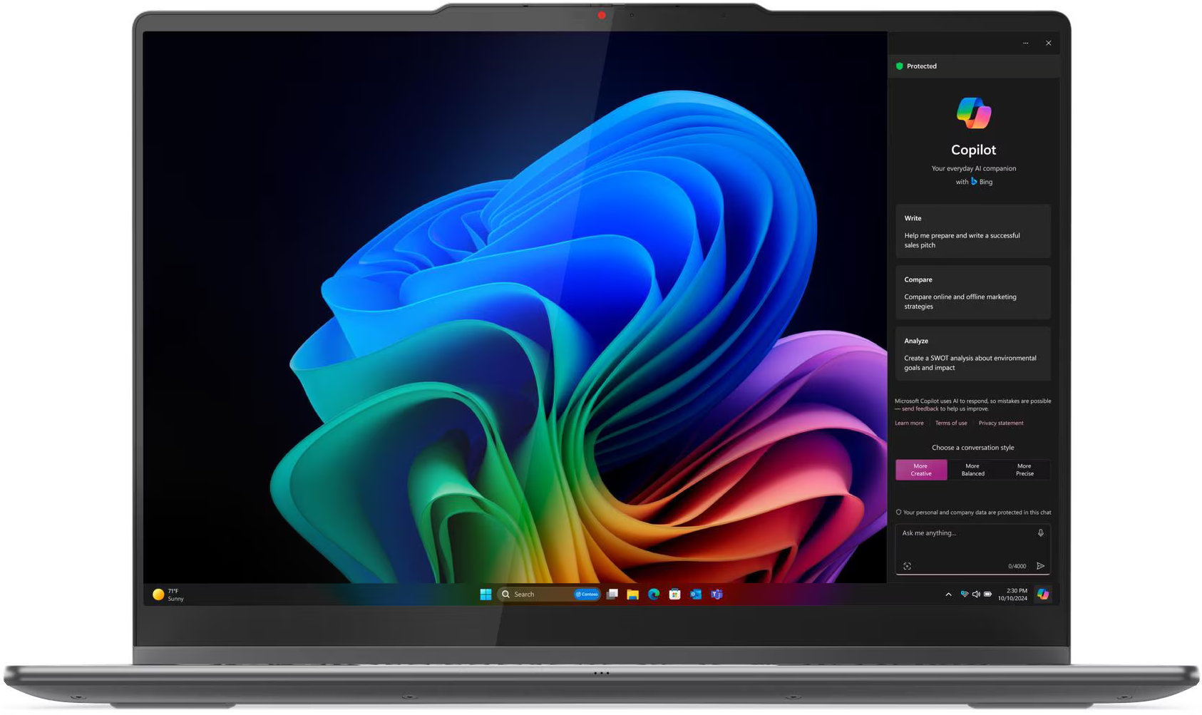 Egy laptop színes, absztrakt háttérrel és Copilot ablakával.