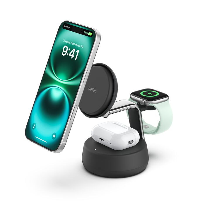 Un soporte de carga con iPhone, Apple Watch y AirPods.