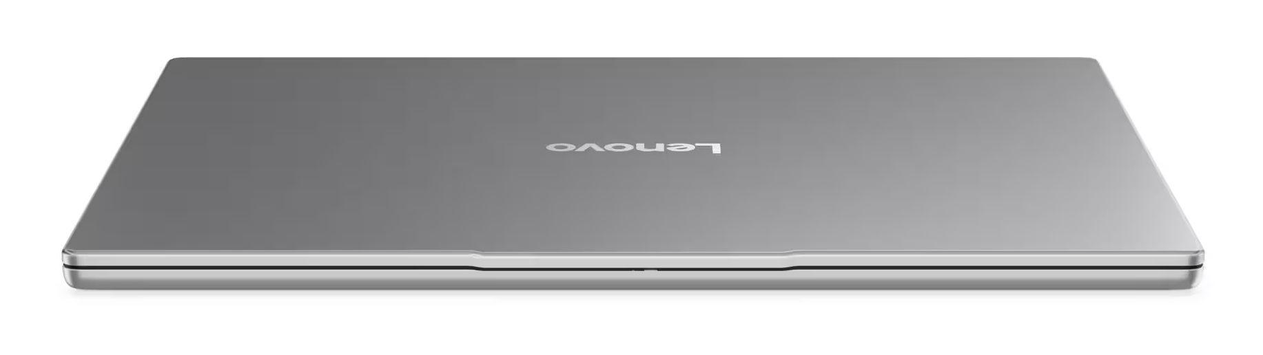 Zamknięty srebrny laptop z logo Lenovo na pokrywie, na białym tle.