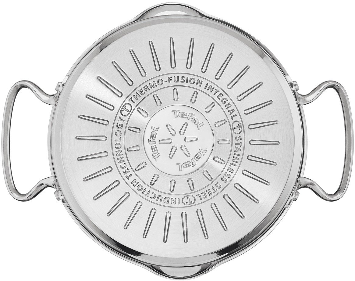 Spód garnka Tefal ze stali nierdzewnej z uchwytami i wygrawerowanymi liniami.