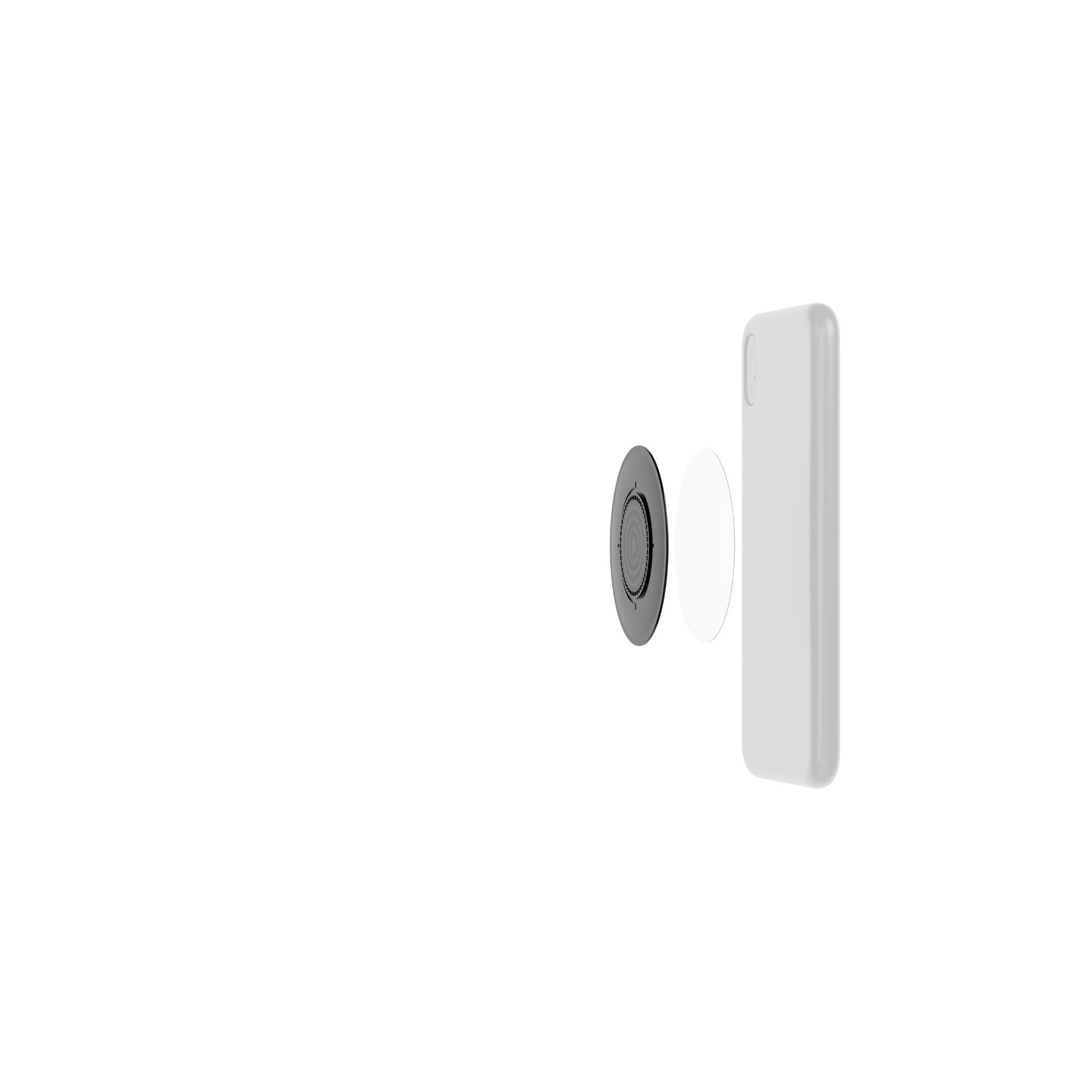 Ein weißes Smartphone liegt neben einem schwarzen Magnetring und einem weißen Klebepad.