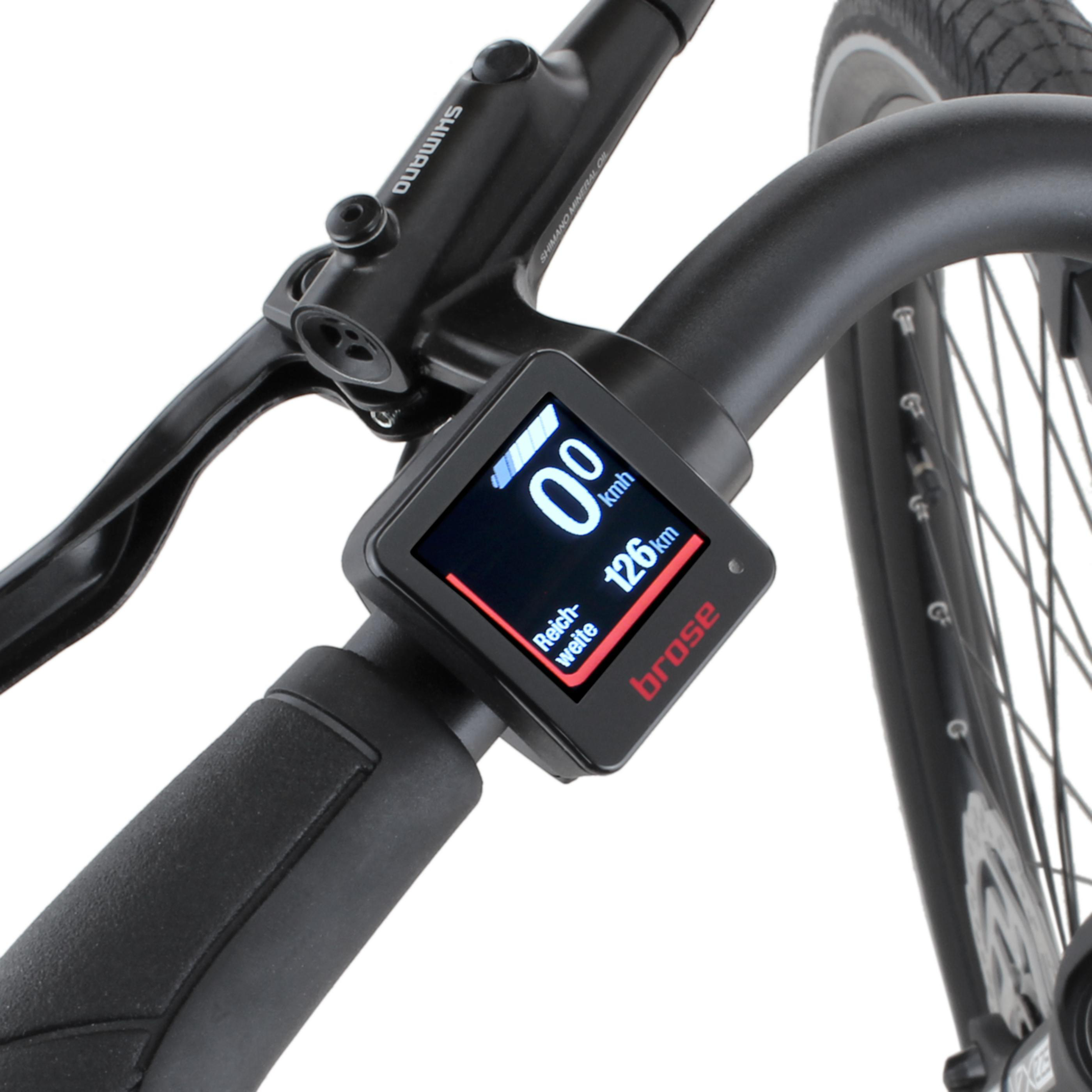 Nahaufnahme eines Fahrrad-Displays mit Geschwindigkeit und Reichweite.