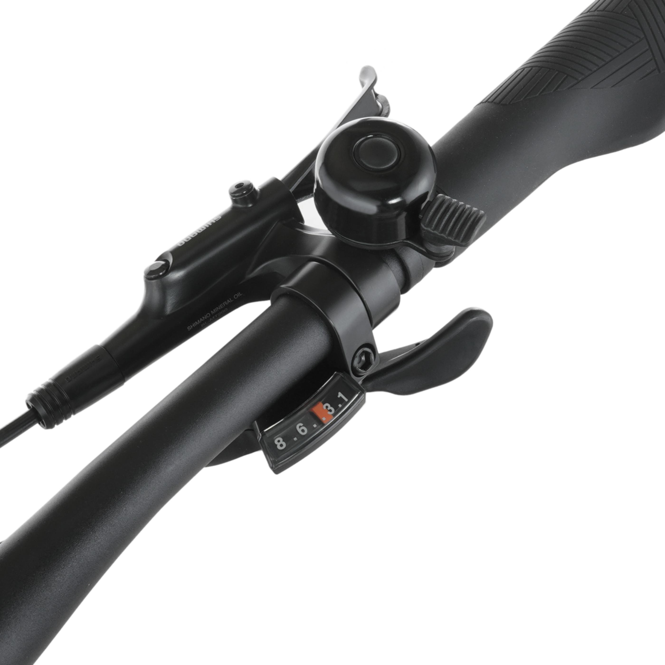 Nahaufnahme eines schwarzen Fahrradlenkers mit Schalthebel und Klingel.