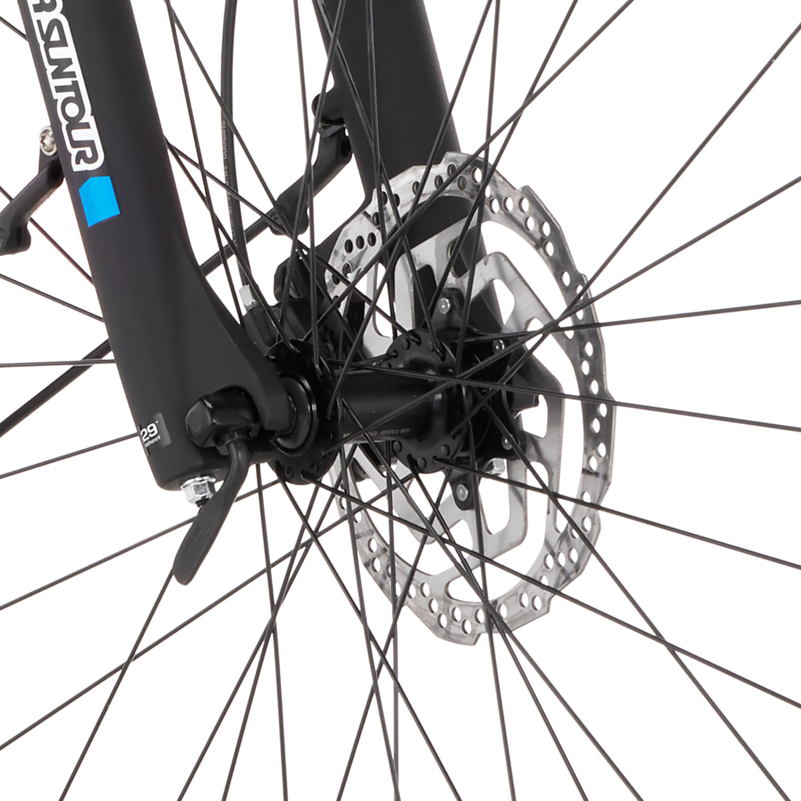 Nahaufnahme eines Fahrrad-Scheibenbremssystems mit Speichen und Gabel.
