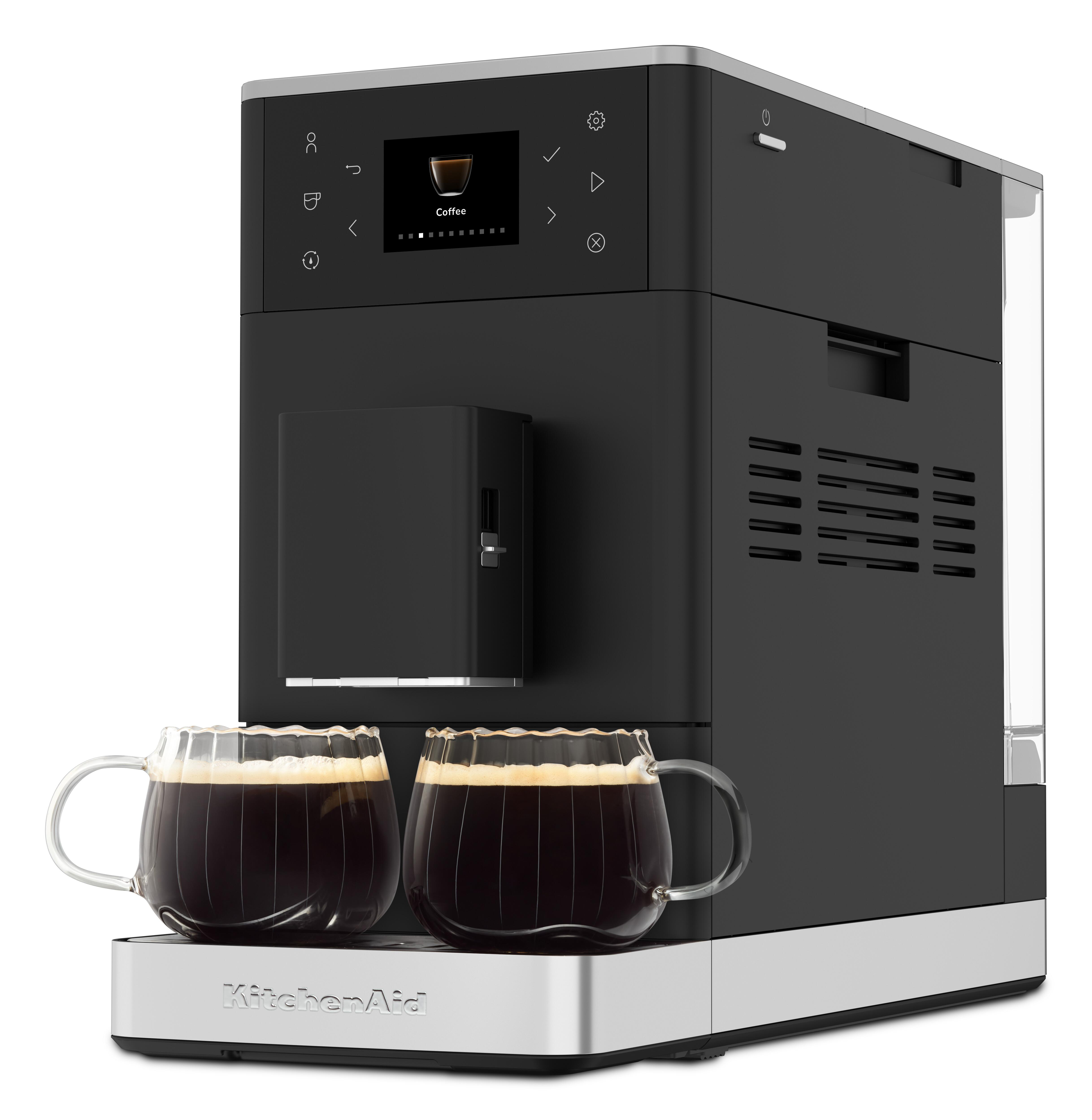 Eine schwarze Kaffeemaschine mit zwei Glasbechern voller Kaffee auf der silbernen Basis.