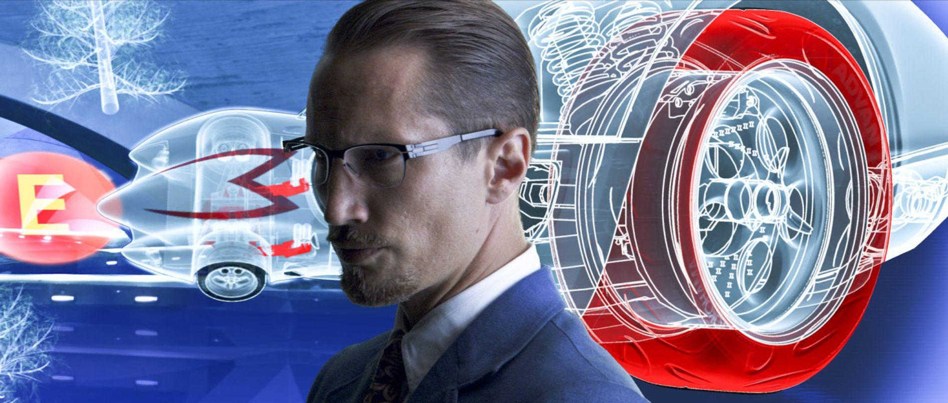 Ein Mann mit Brille und Anzug vor schematischer Darstellung eines Autos und Rads.
