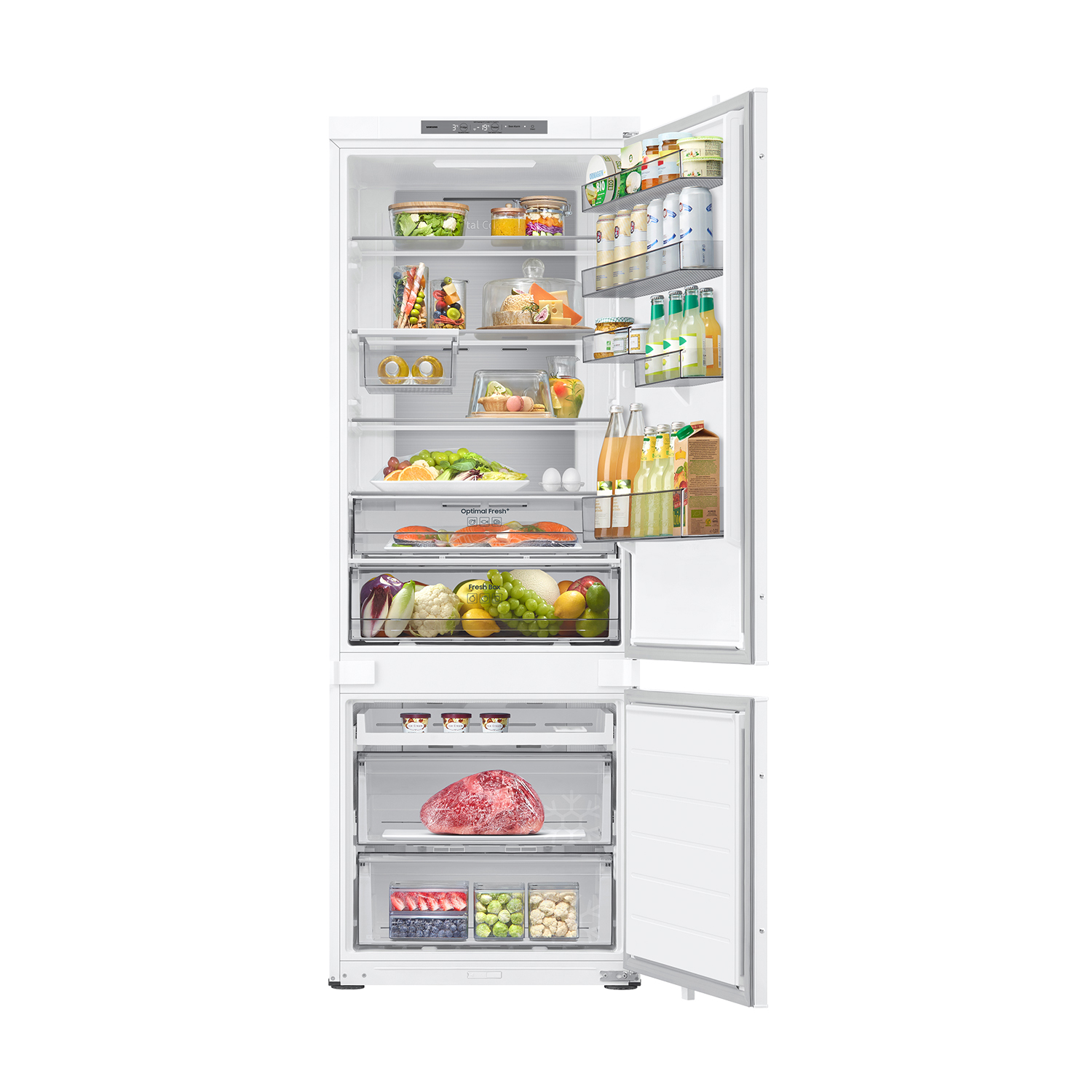 Un refrigerador blanco abierto lleno de alimentos como frutas, verduras, carne y bebidas.
