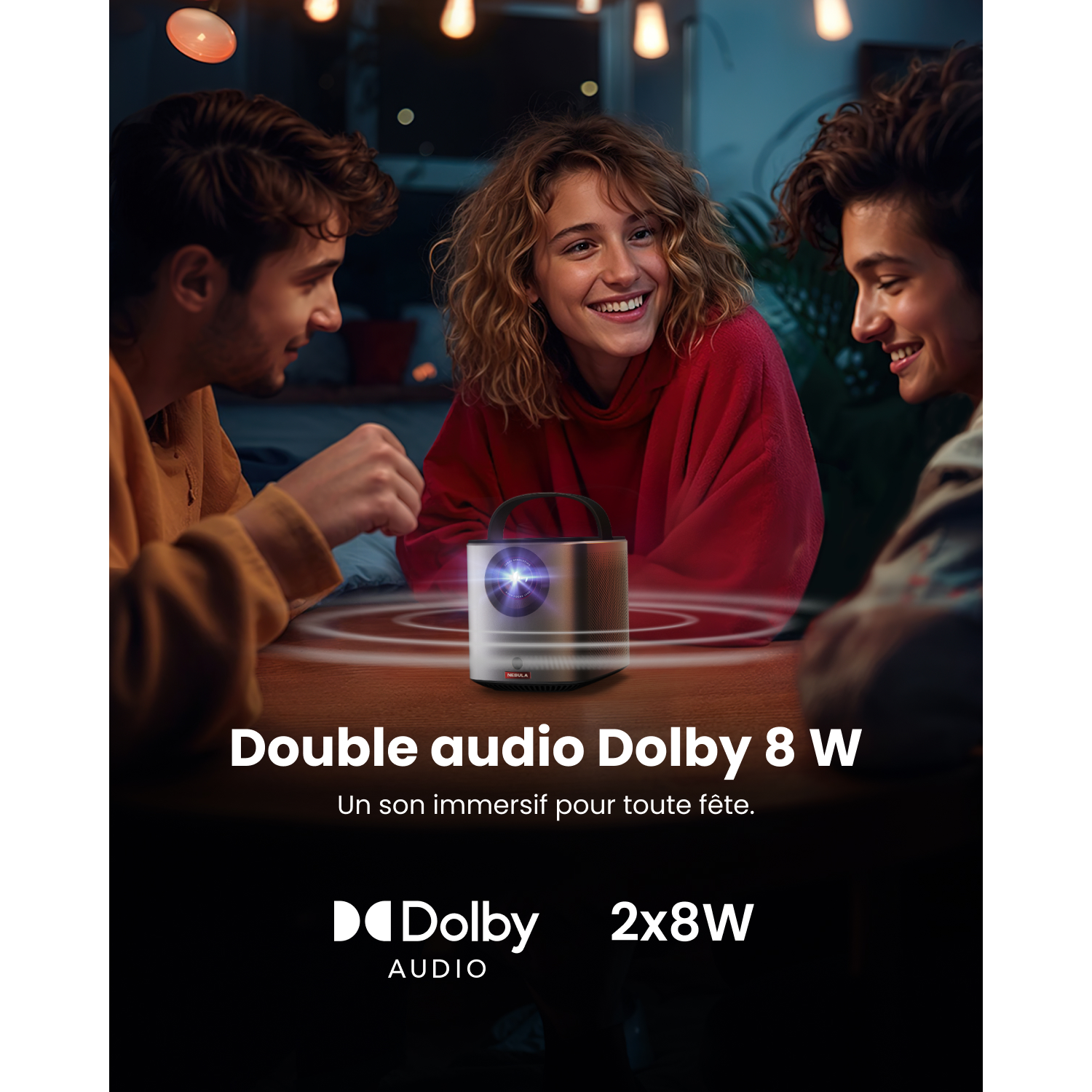 Three young people laugh around a projector. Dolby Audio 2x8W.