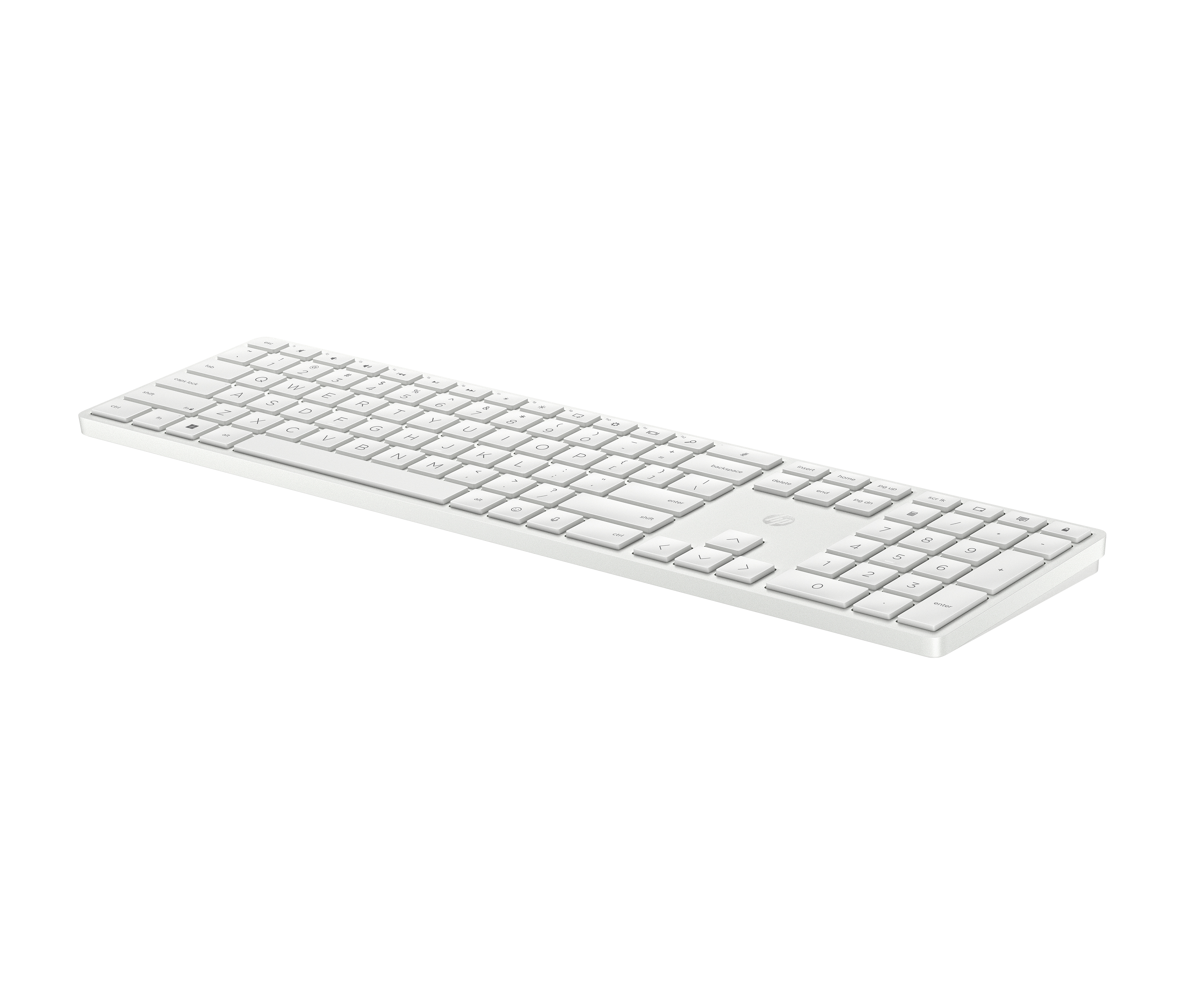 Eine weiße Tastatur mit Nummernblock, auf schwarzem Hintergrund.