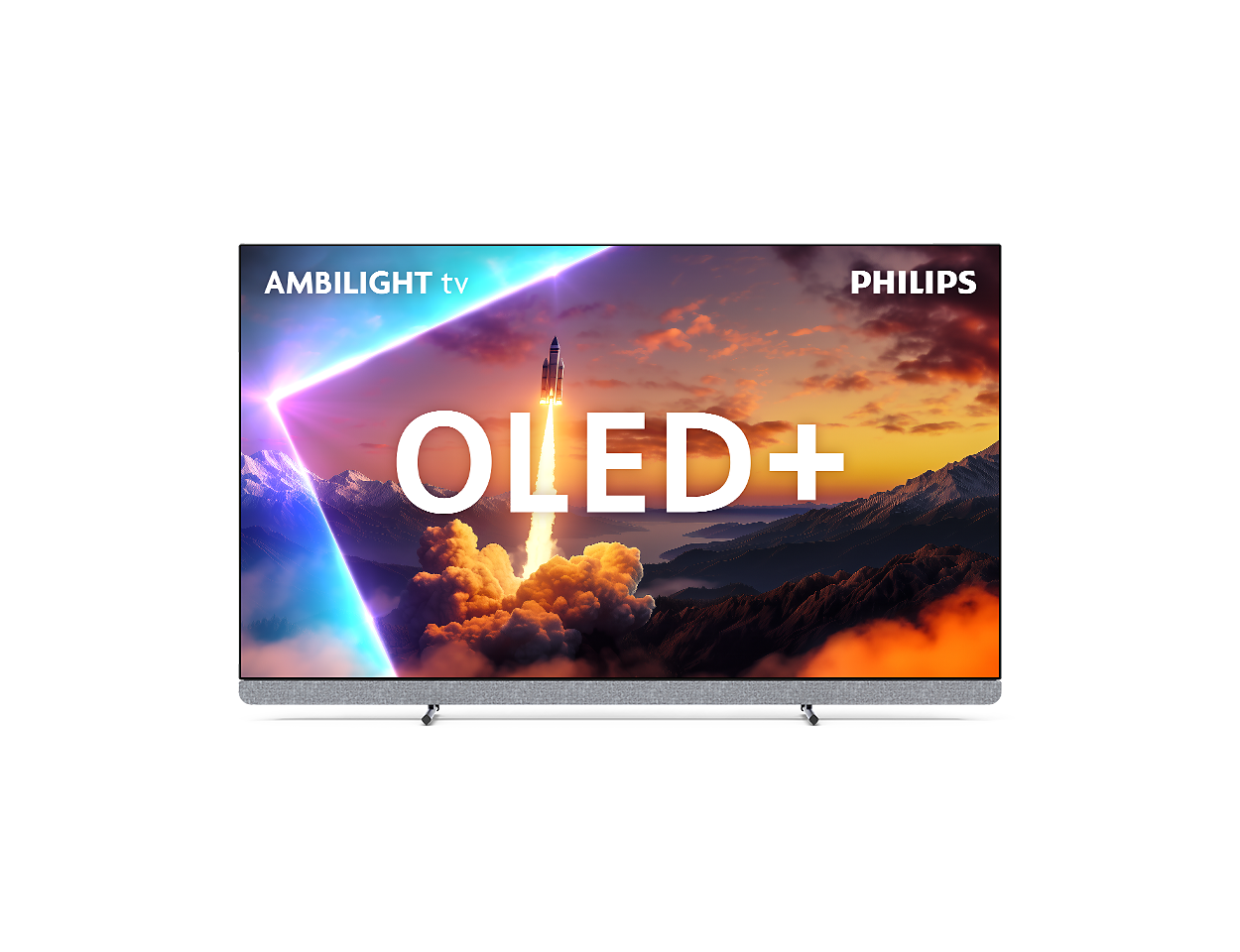 Telewizor Philips OLED+ pokazuje start rakiety na tle górskiego krajobrazu.