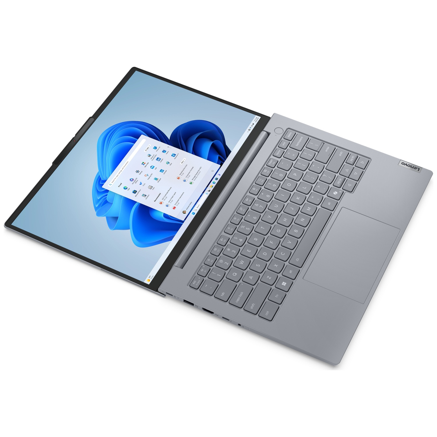 Grey Lenovo laptop with screen open, displaying Windows 11 interface.