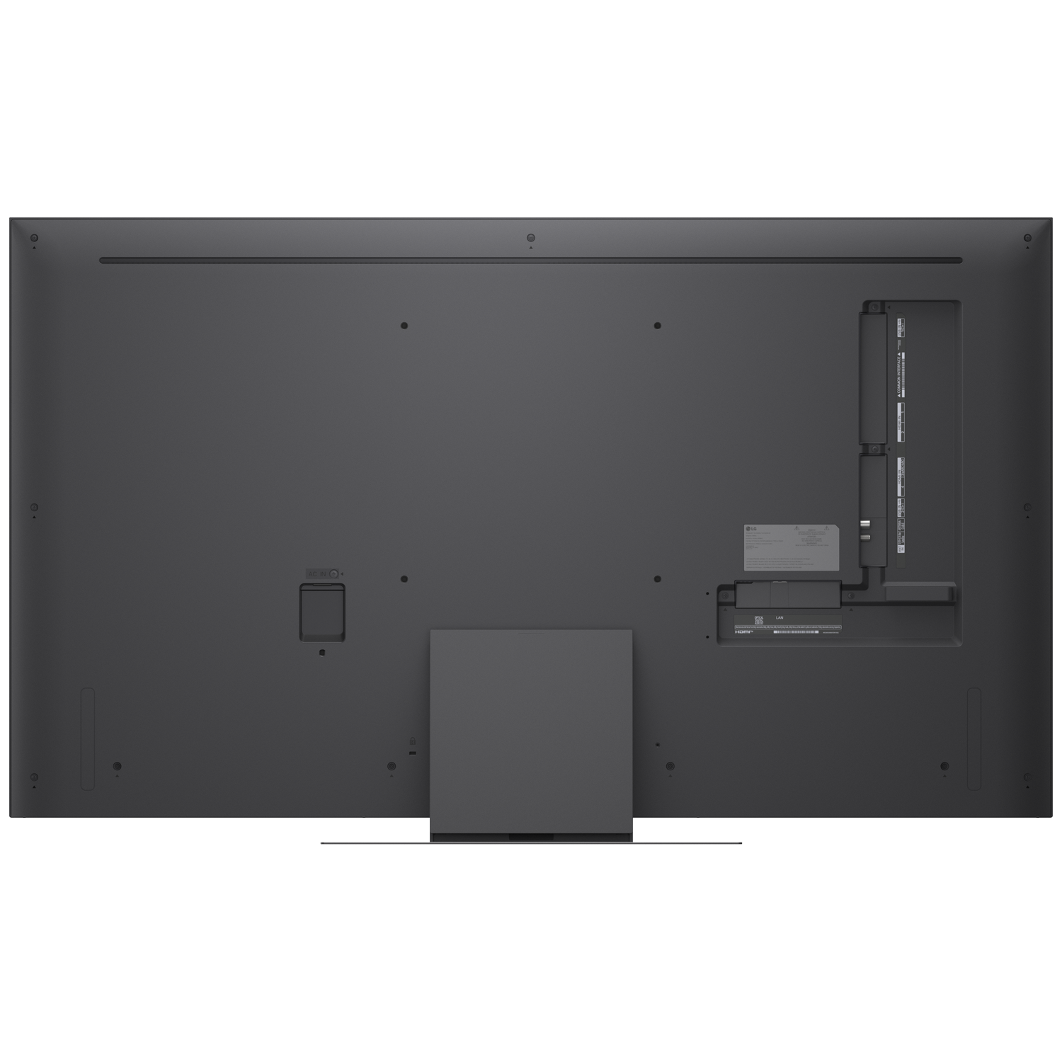 Back view of a large black television with ports and a stand.