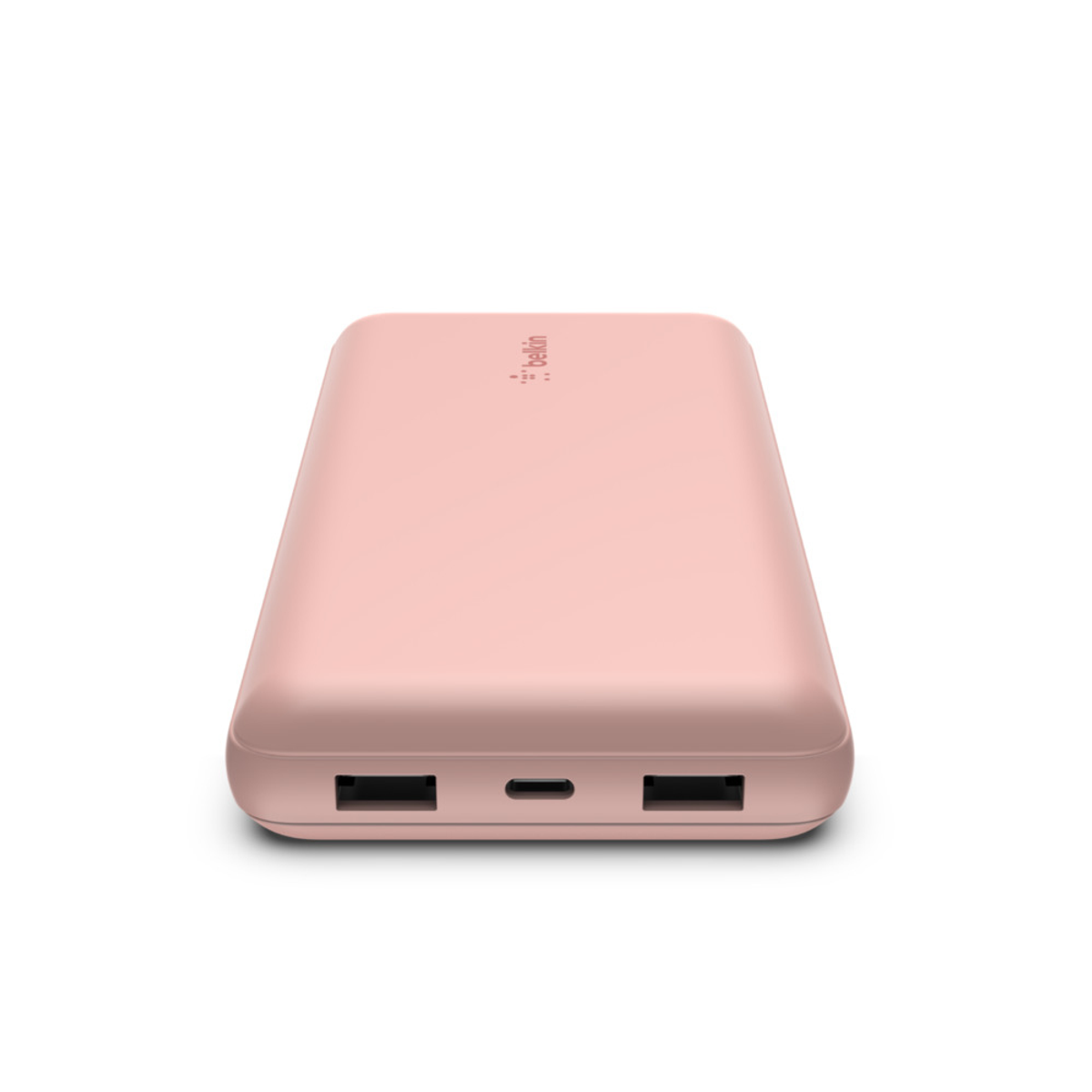 Una batería externa rosa con dos puertos USB y un puerto USB-C.
