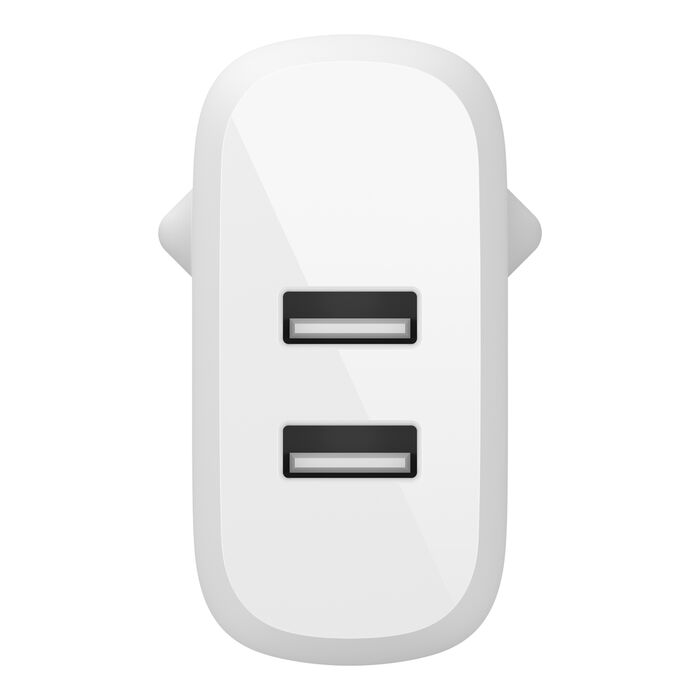 Un adaptador de corriente USB doble blanco con dos puertos USB negros.