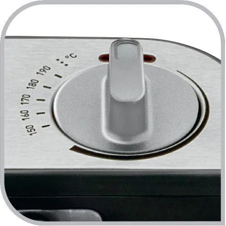 Un dial plateado en un panel metálico con escala de temperatura de 150-190°C.