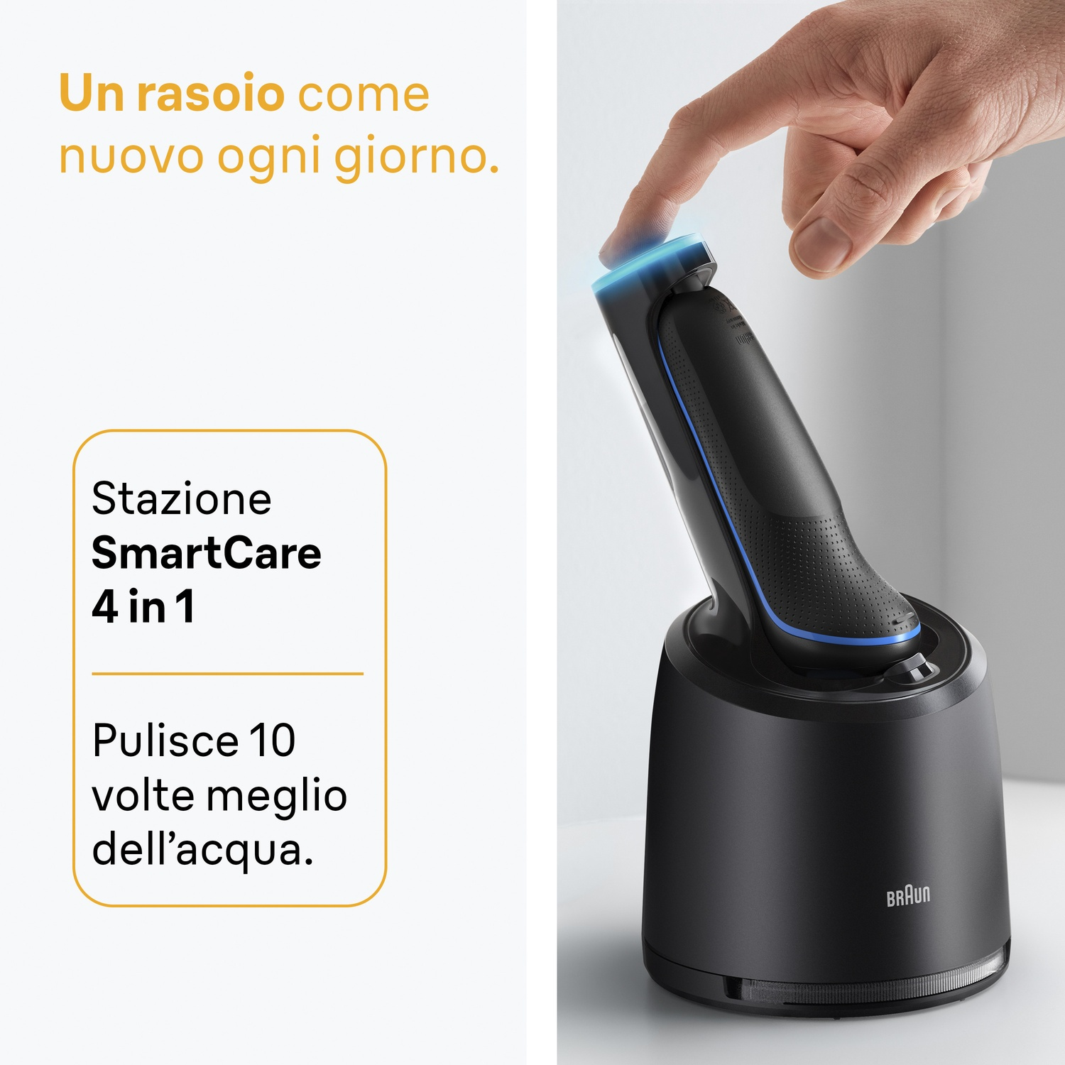 Un uomo tocca un rasoio Braun nero sulla sua stazione di ricarica.