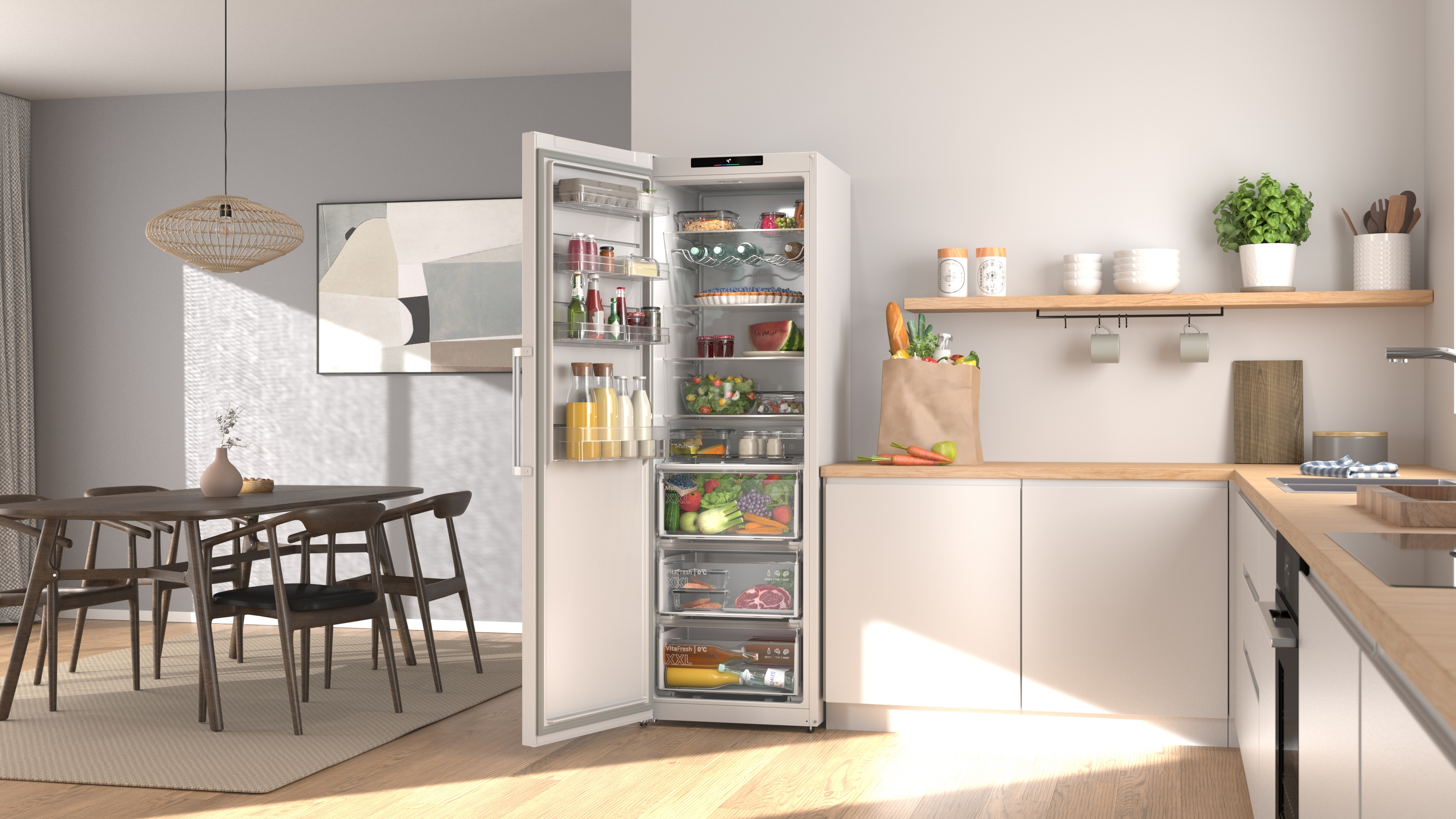An open white refrigerator with food, next to a dining table and chairs.