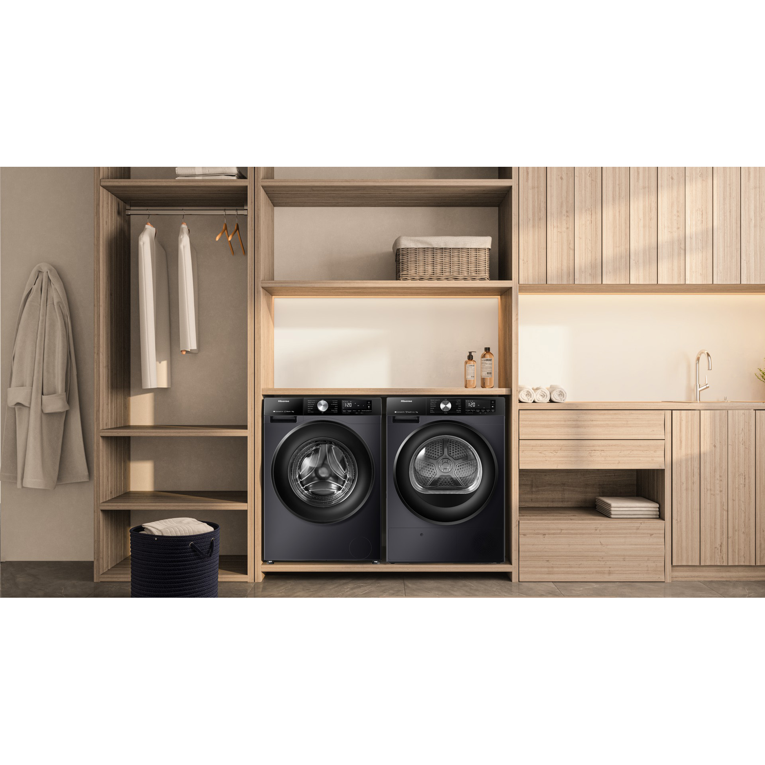 Black washing machine and dryer side-by-side in a wooden cabinet.