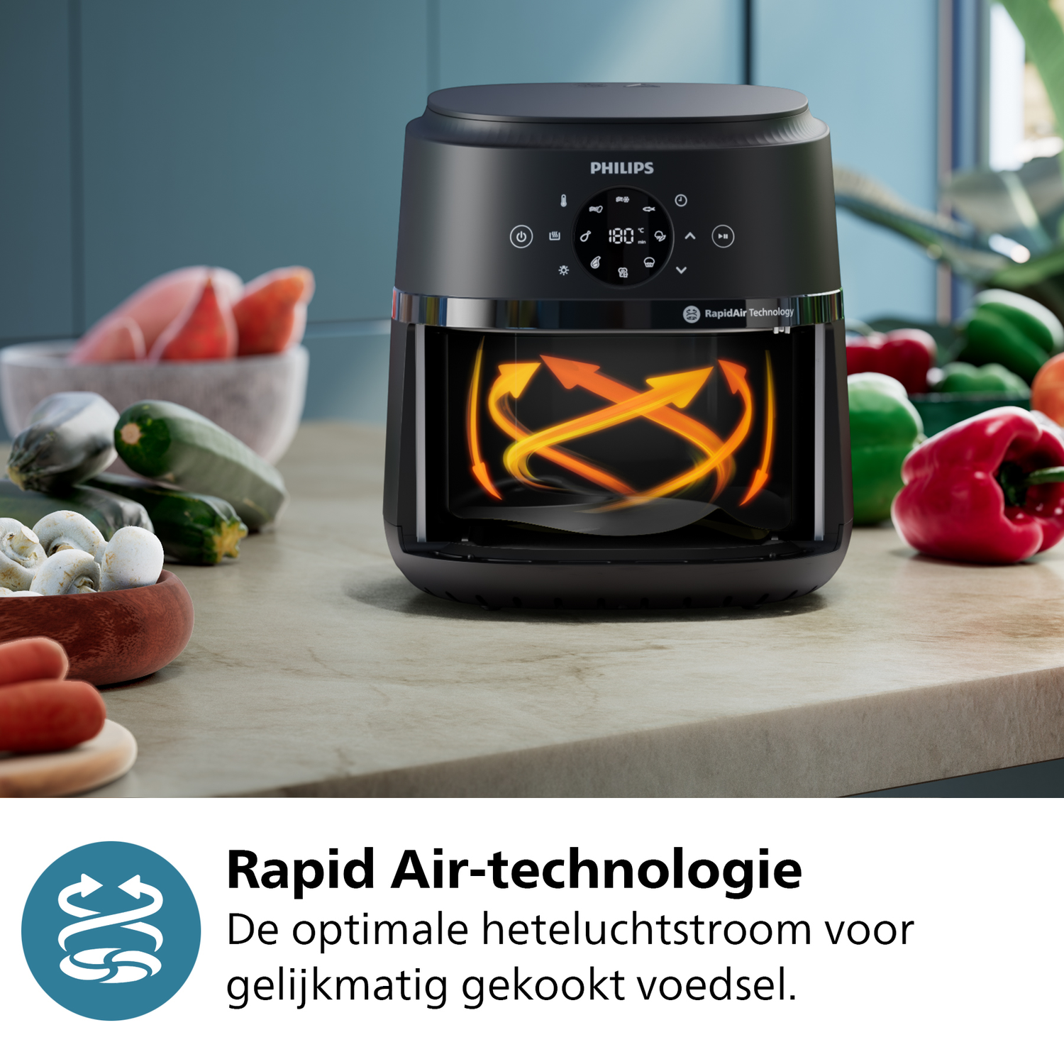 A black Philips air fryer with orange heating coils and vegetables.