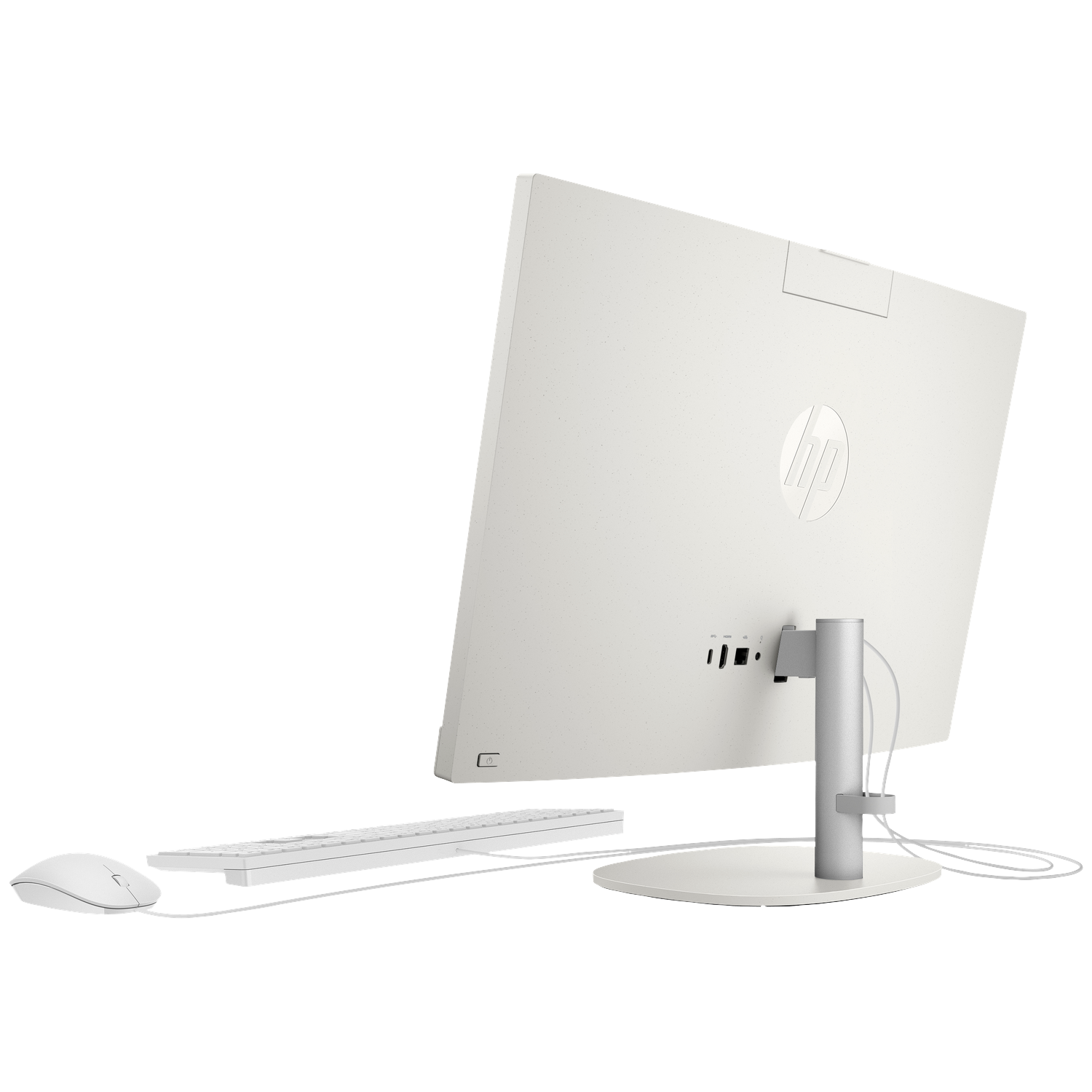 White all-in-one computer with keyboard and mouse, rear view showing ports.
